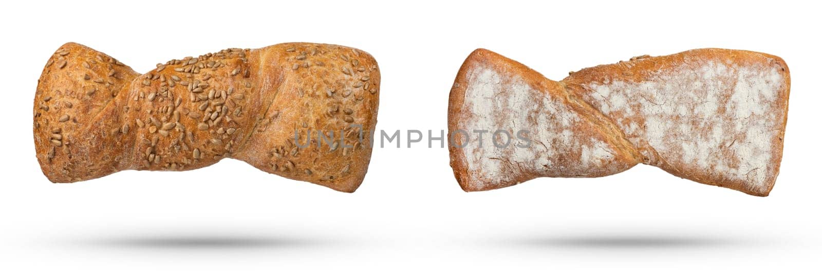 Homemade white bread isolate with seeds and whole grains. Top and bottom view of a loaf of fresh bread on a white isolated background. The concept of baking bread