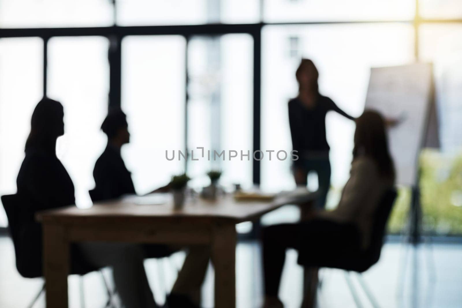 Silhouette, meeting and blur of business people in office for presentation, planning and conversation. Corporate workplace, collaboration and men and women for teamwork, communication and strategy by YuriArcurs