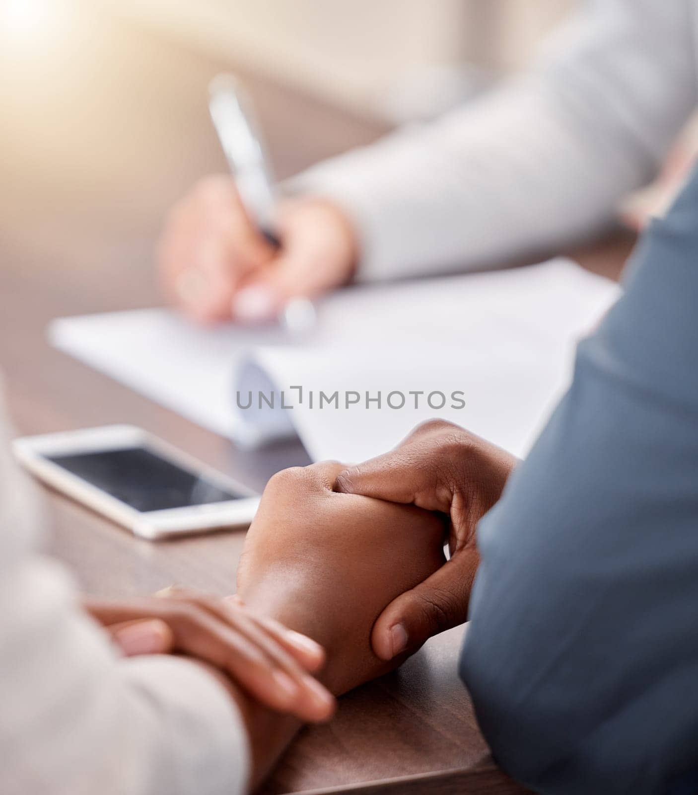 Holding hands, black couple and contract of people in a life insurance meeting with solidarity. Marriage support, love and care busy with documents for healthcare agreement and policy deal at desk by YuriArcurs