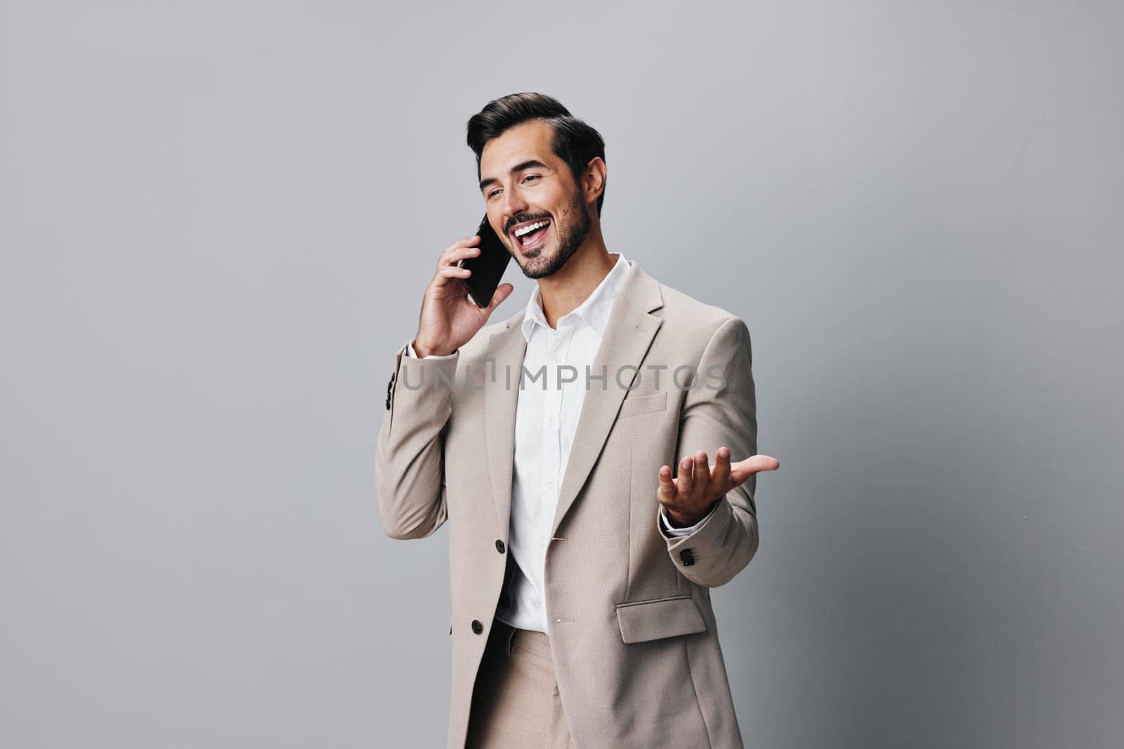 man phone hold smartphone suit business portrait happy smile blogger call by SHOTPRIME