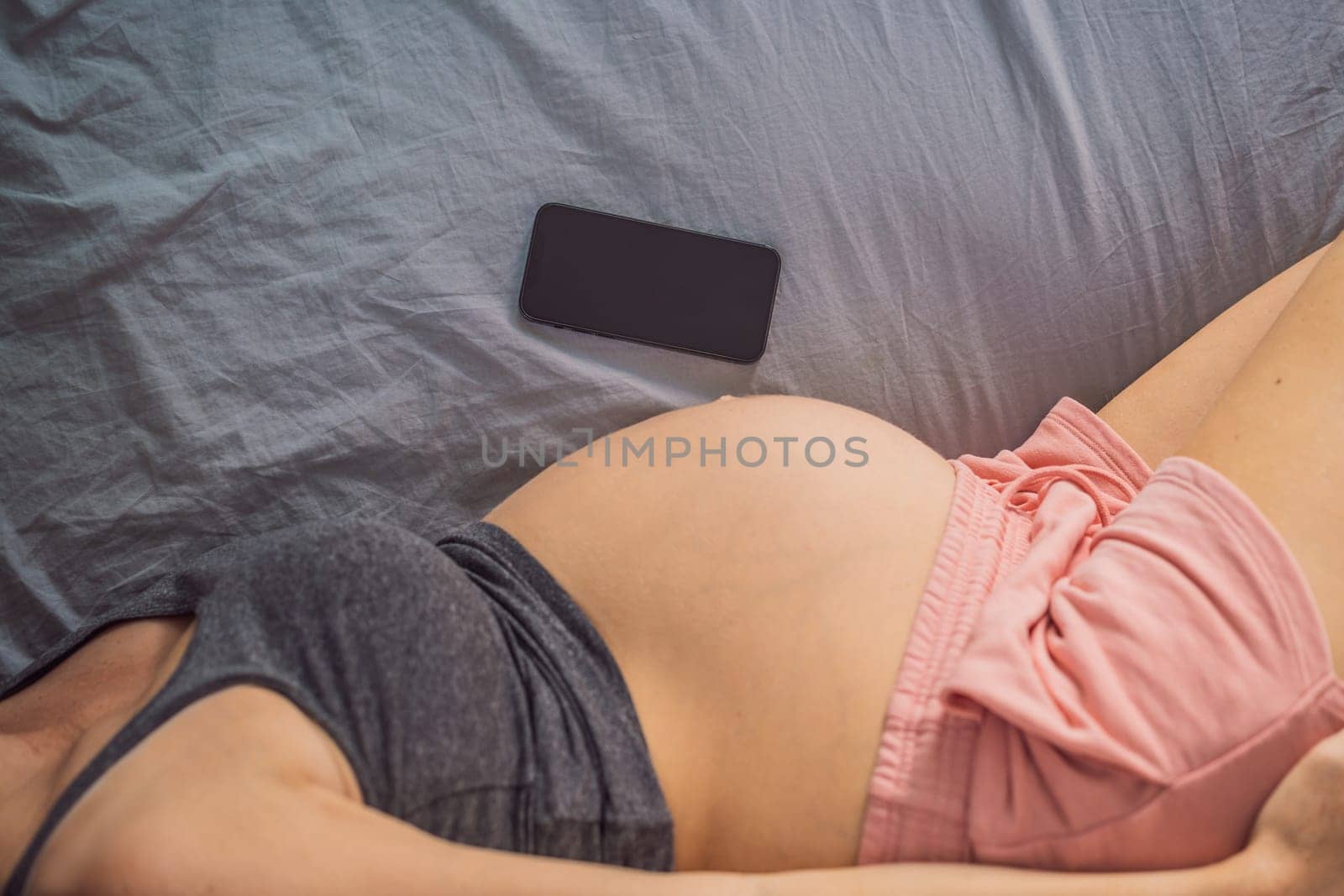 Pregnancy mockup app. Mobile pregnancy online maternity application. Pregnant mother using phone mock up. Pregnancy, medicine, pharmaceutics, health care and people concept.