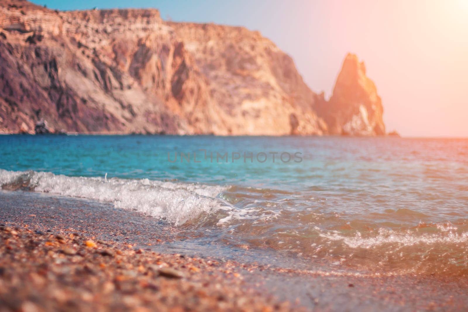 Abstract nature summer ocean sunset sea background. Small waves on water surface in motion blur with bokeh lights from sunrise. Holiday, vacation and recreational background concept by panophotograph