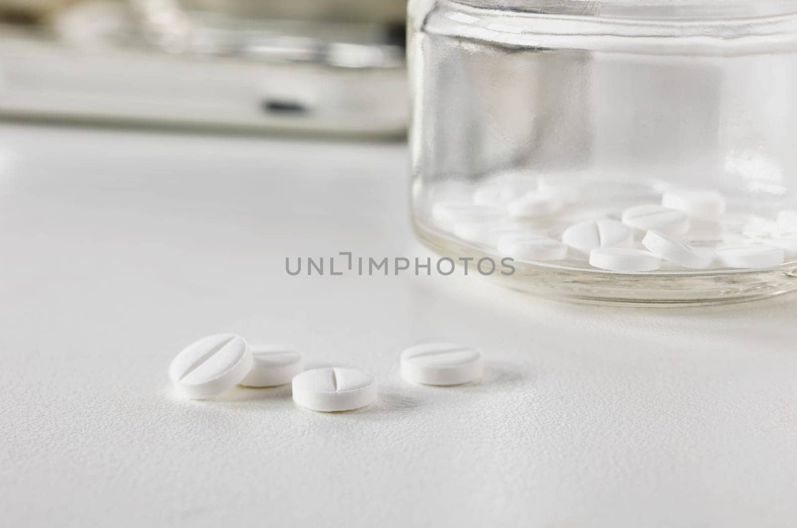 White medicine pills on white table, hearth care  and medicine