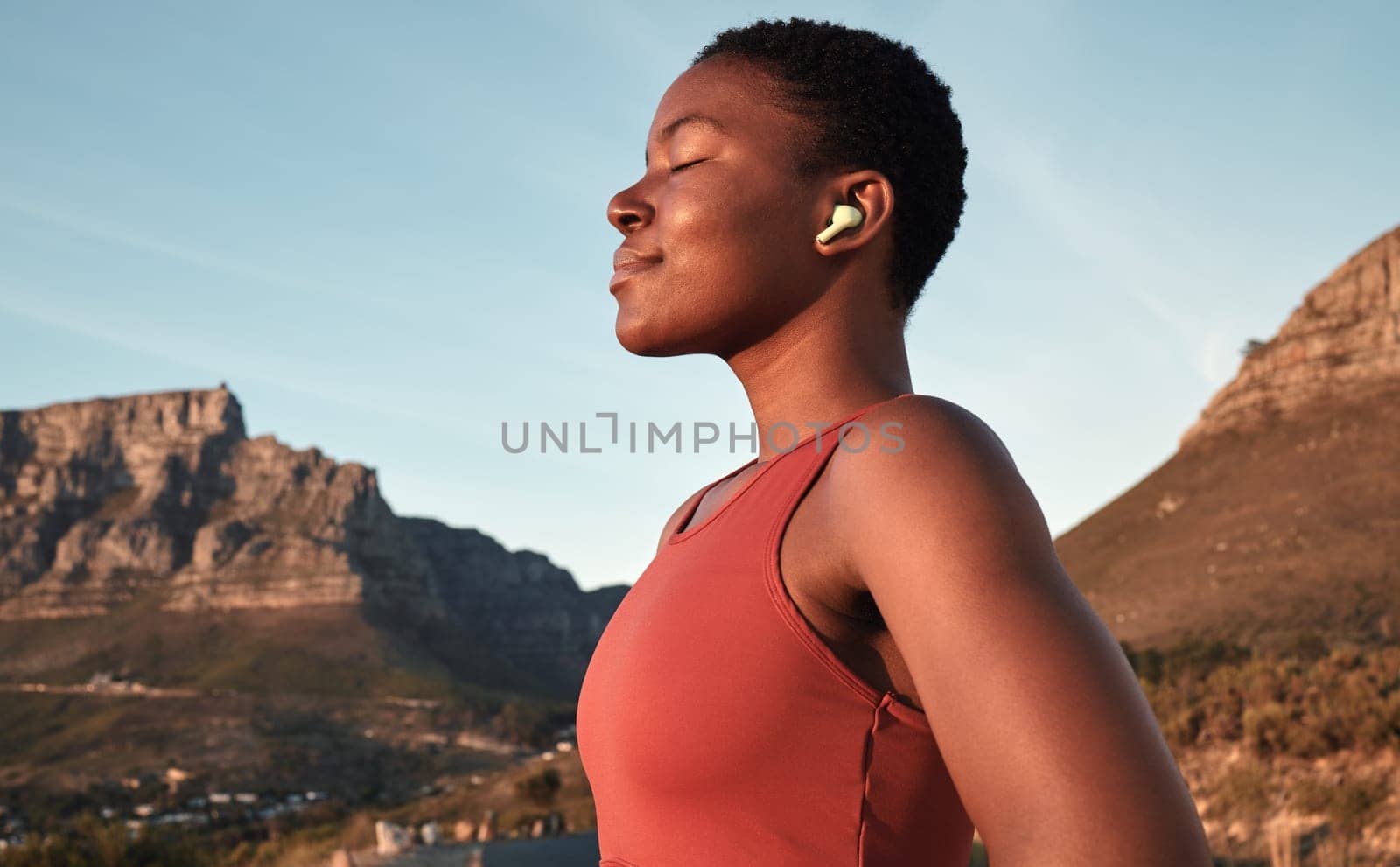 Calm black woman, outdoor fitness and breathing in nature, Cape Town mountains and meditation of motivation, health or relax mindset. Female athlete, breathe and workout peace for zen sports wellness.