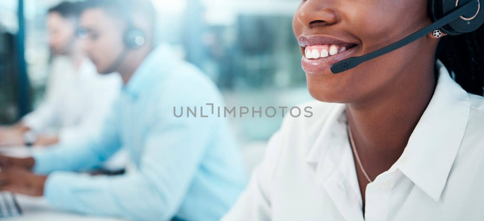 Call center, telemarketing and closeup of a woman mouth with a headset doing an online consultation. Customer support, contact us and consultant with a crm strategy in customer service in the office. by YuriArcurs