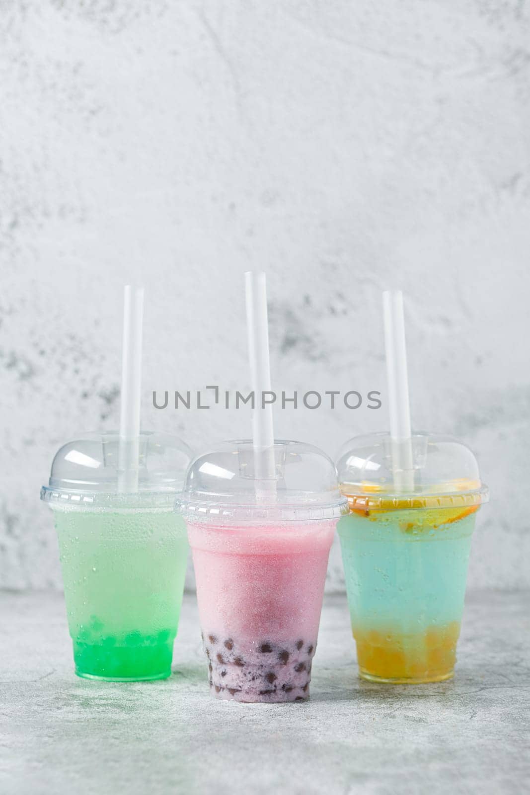 Fruity Bubble Tea in glass cup on dark background