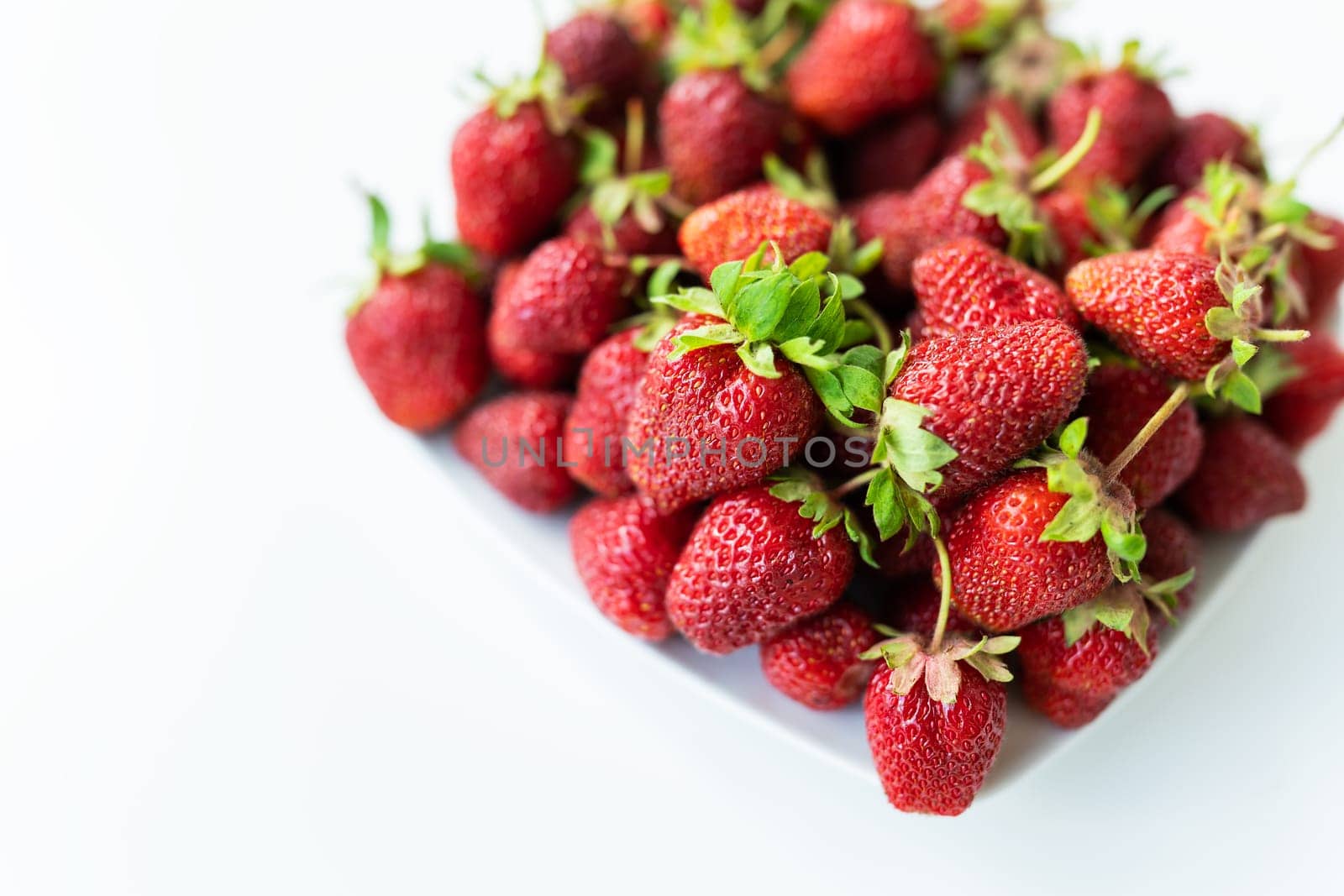 Ripe picked strawberries on the table. Collection of fresh organic strawberries. Delicious and sweet berry. by sfinks