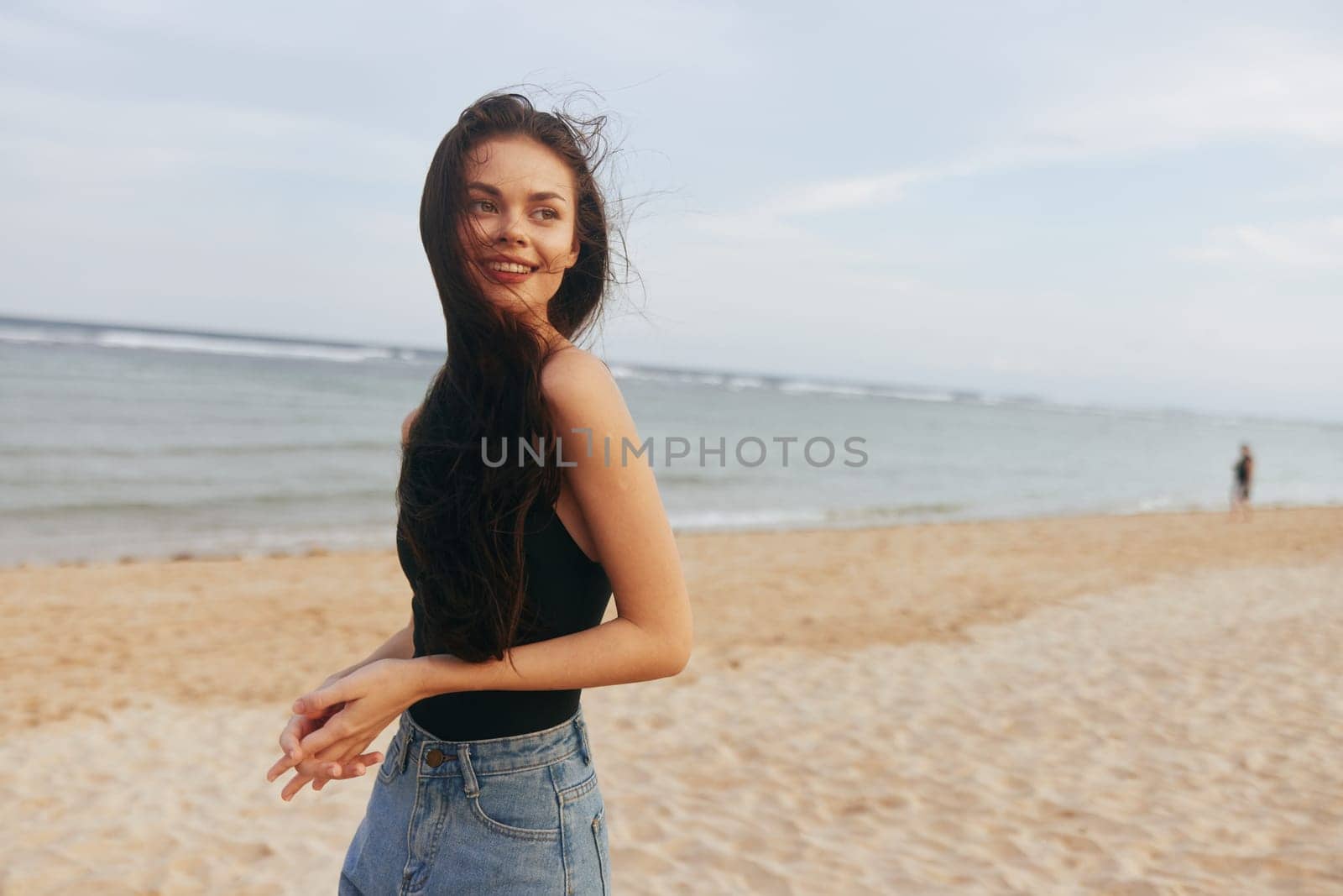 woman lifestyle smile long copy summer beach happiness tropical nature young outdoor free sand ocean vacation beauty sea hair space relax person sunset