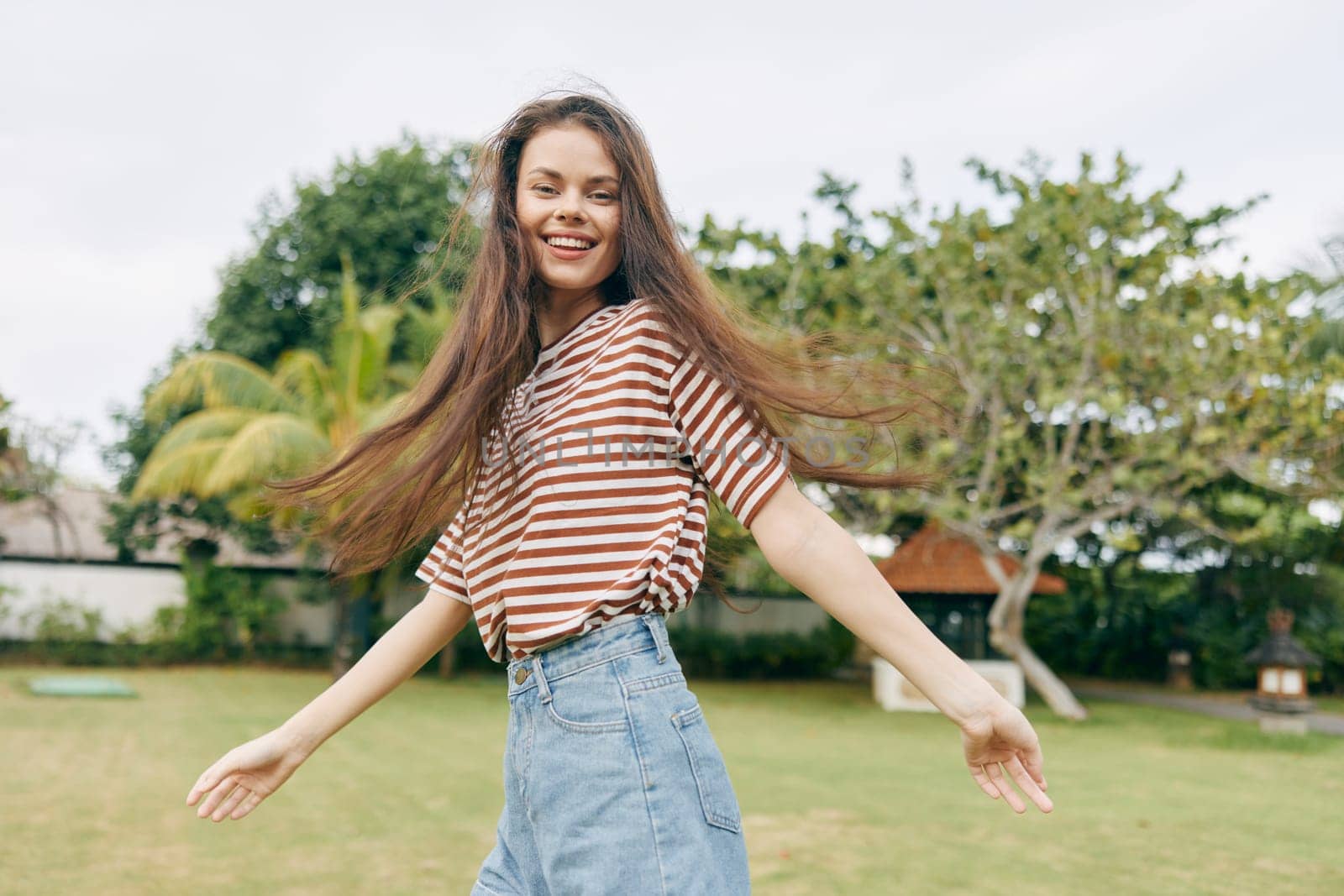 woman exercise park lifestyle nature care health beauty wellness meadow enjoy walk smiling natural summer striped freedom relax beautiful sunny run t-shirt