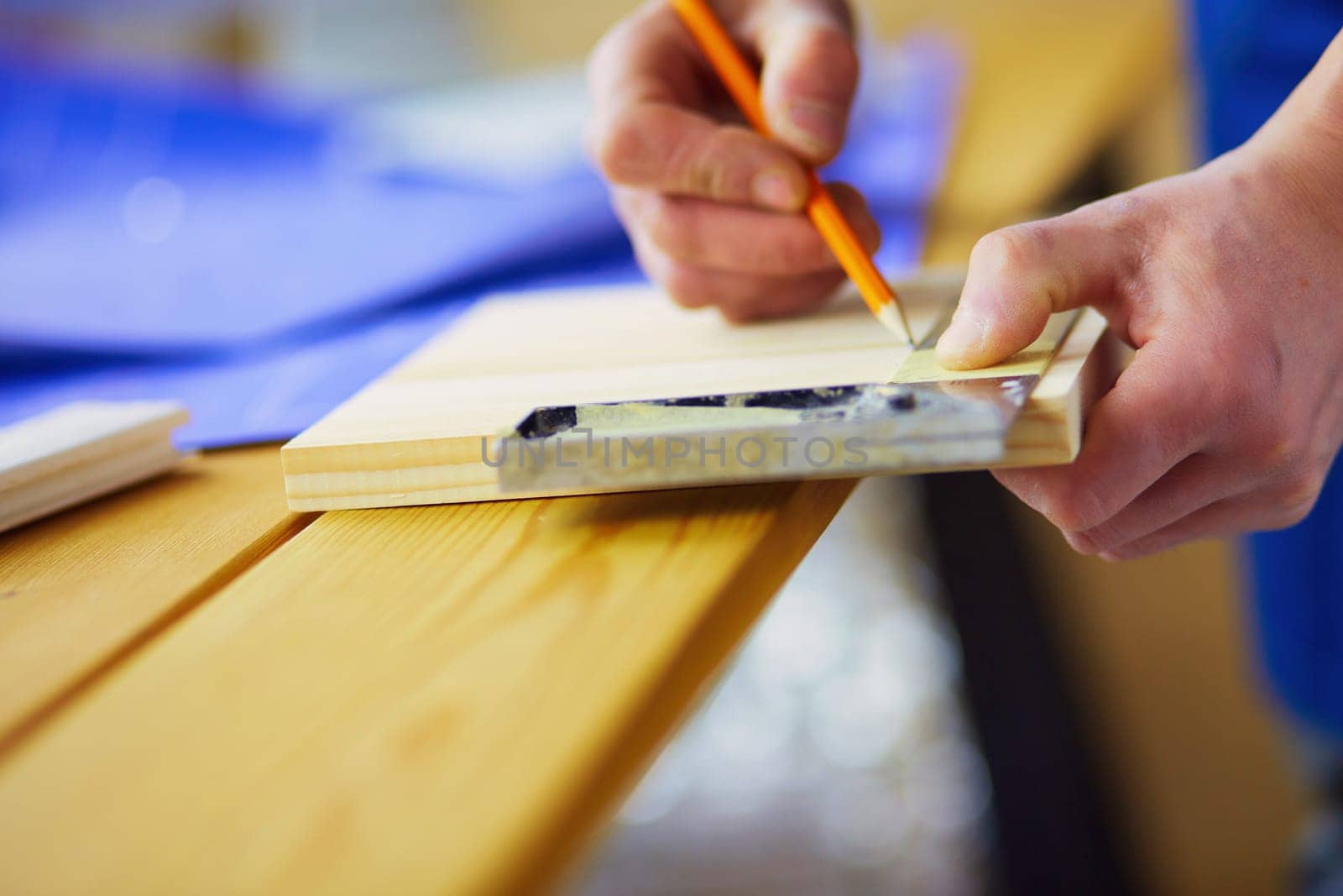 Architect working on drawing table in office.