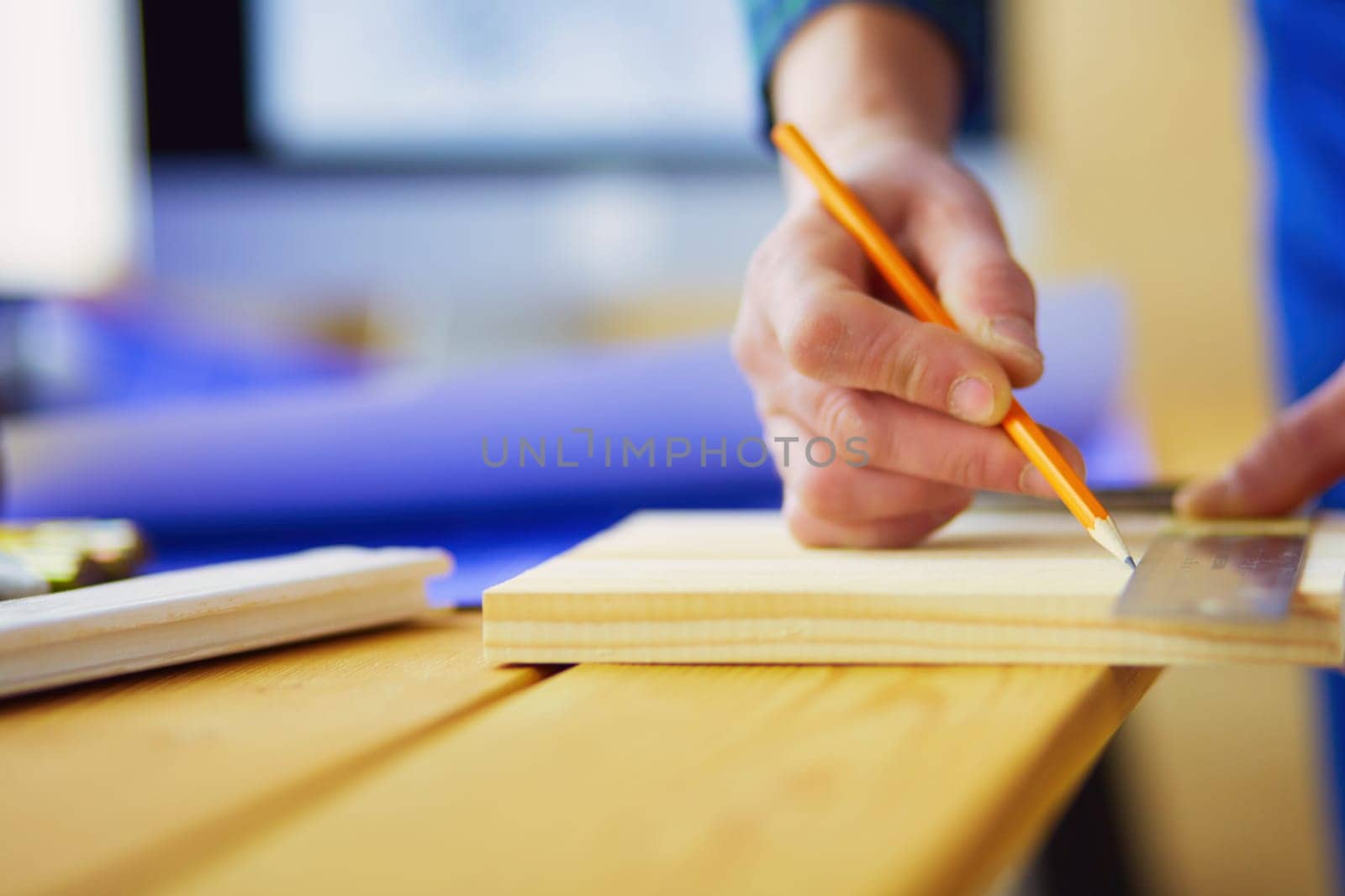 Architect working on drawing table in office.