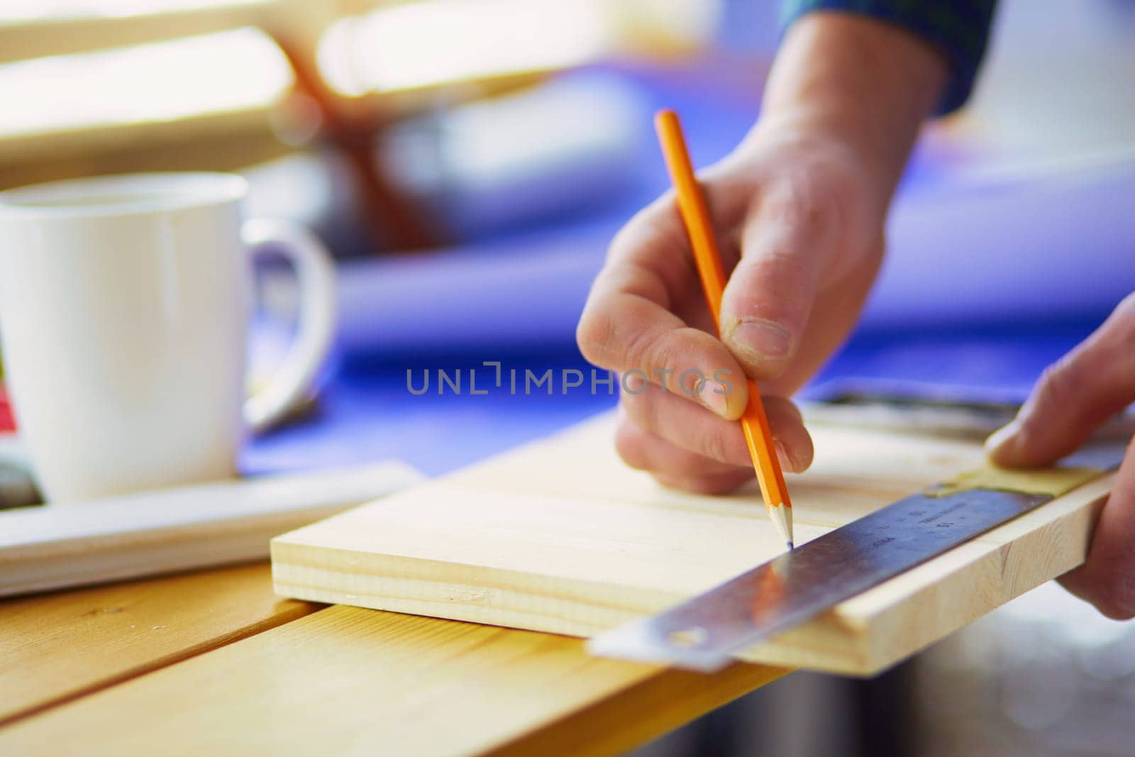 Architect working on drawing table in office.