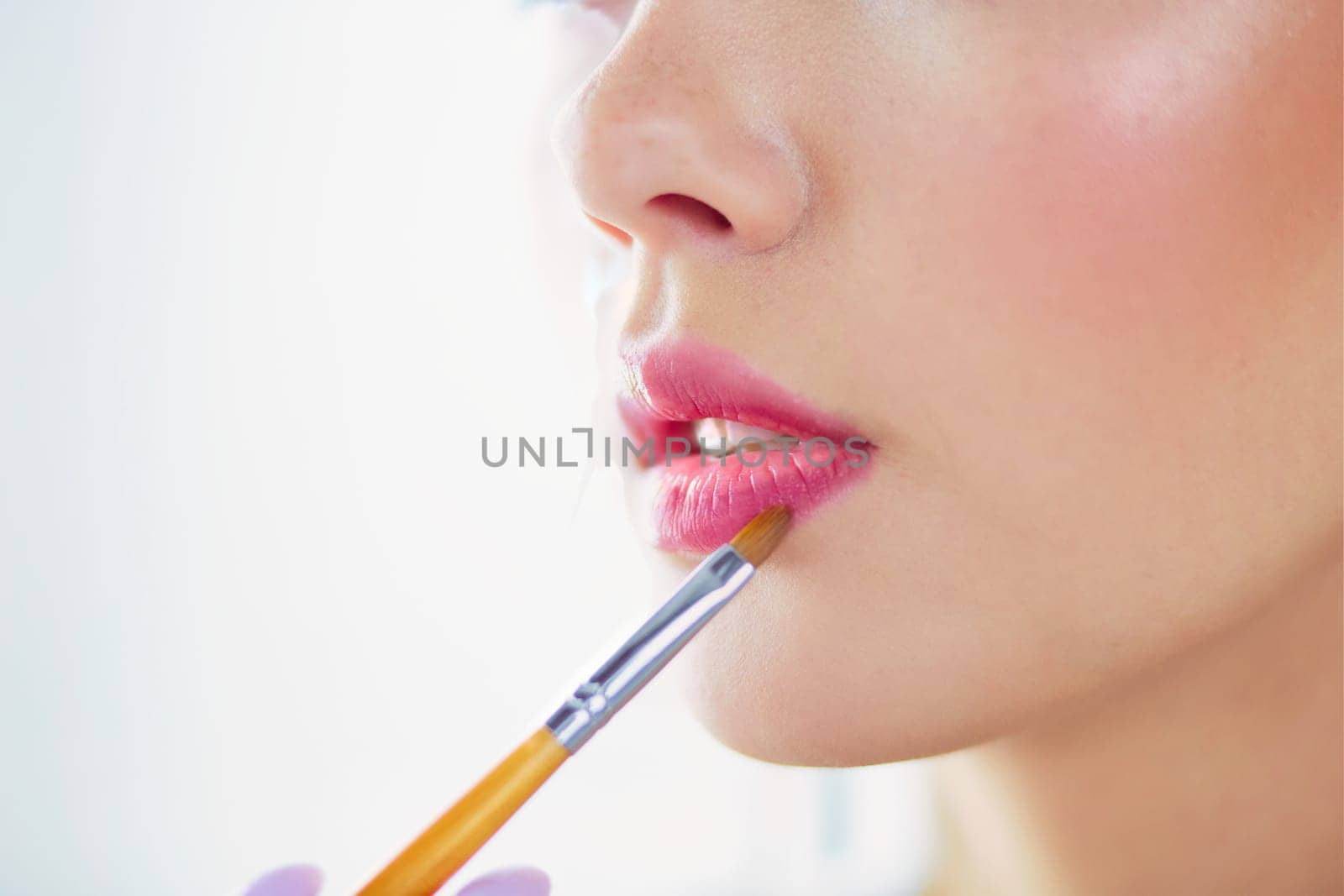 Beautiful girl with cosmetic powder brush for make up. Makeup. Make-up applying for perfect skin.