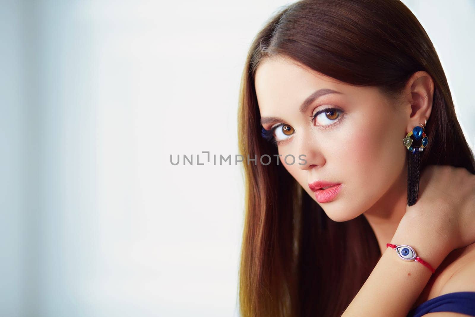 Beautiful young woman with professional make up.