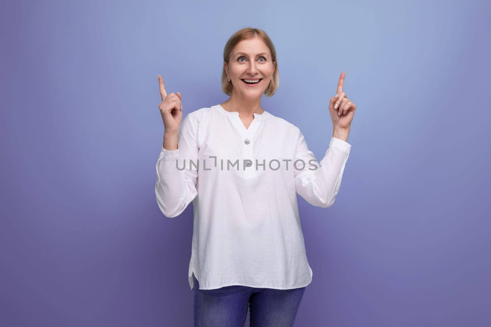 healthy well-groomed blond middle-aged woman in a white blouse by TRMK