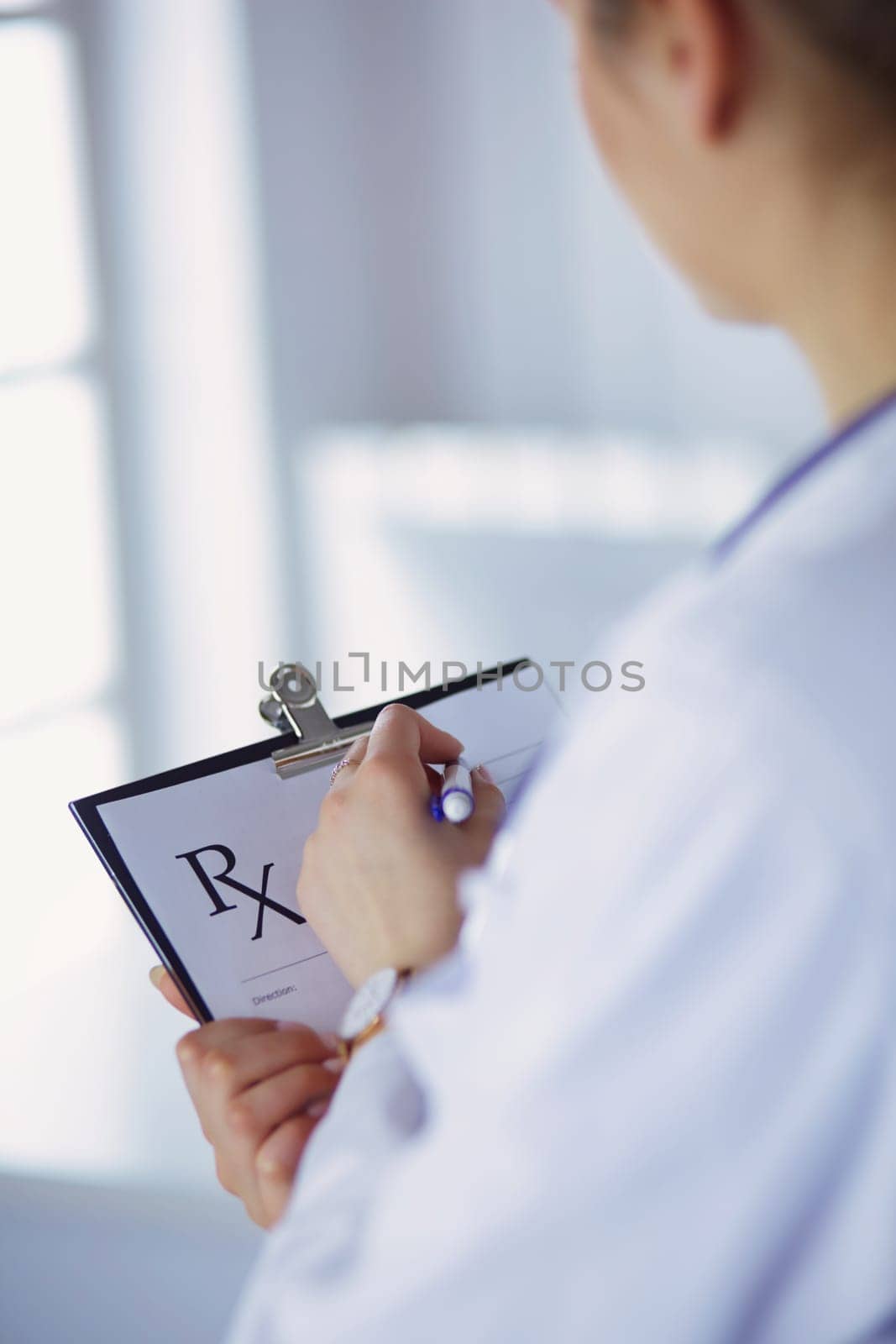 Female doctor holds blank prescription document. office Hospital.
