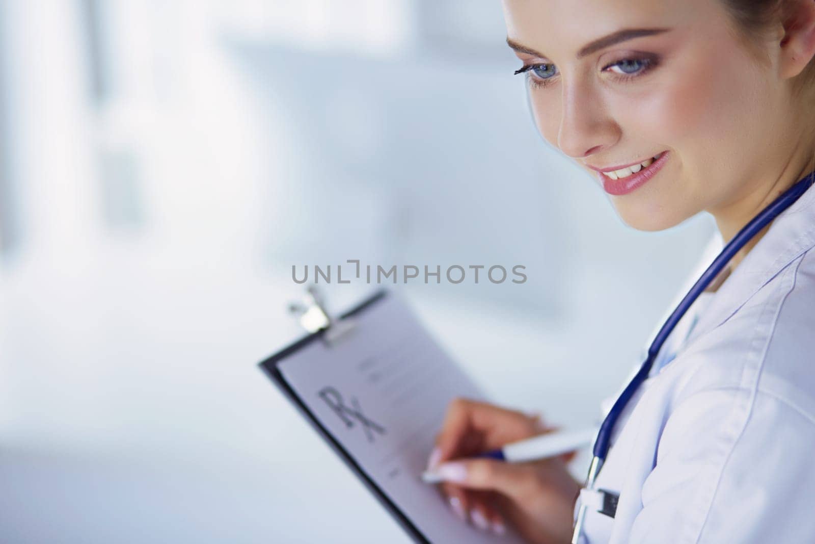 Doctor and RX prescription isolated on white background.