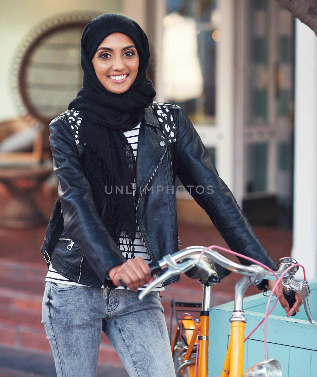 Muslim, woman and city portrait with bike for eco friendly transport, travel and smile with excited face. Happy islamic girl, gen z student and bicycle transportation with sustainability in metro.