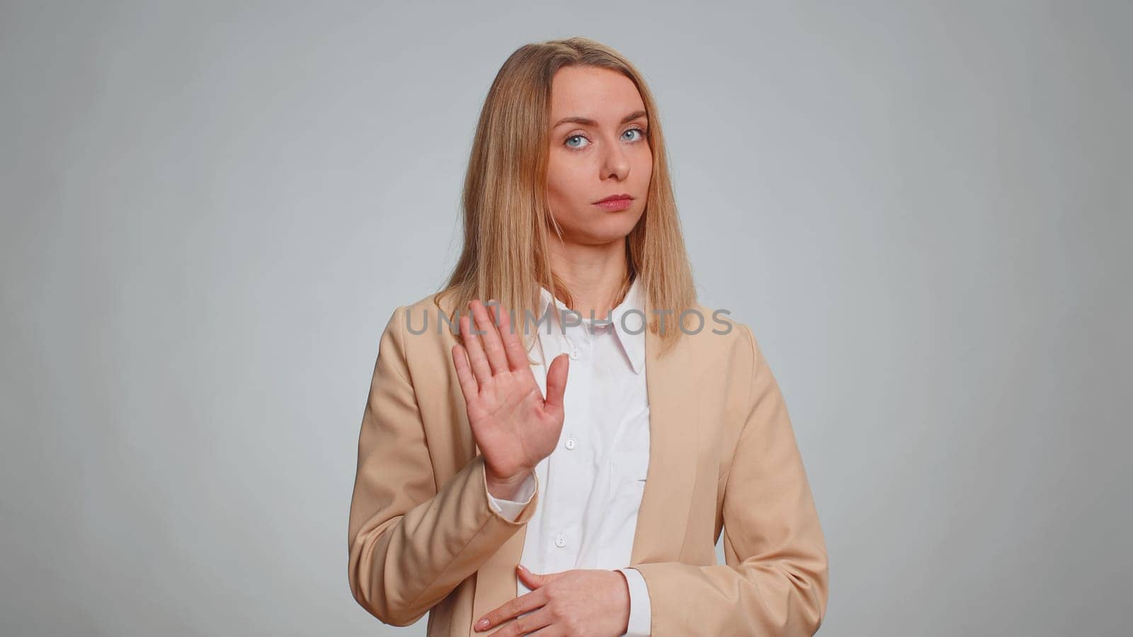 I am not guilty, not my fault. Portrait of young businesswoman pointing fingers herself ask say who me no thanks i do not need it. Female girl in formal suit. Woman isolated on gray studio background