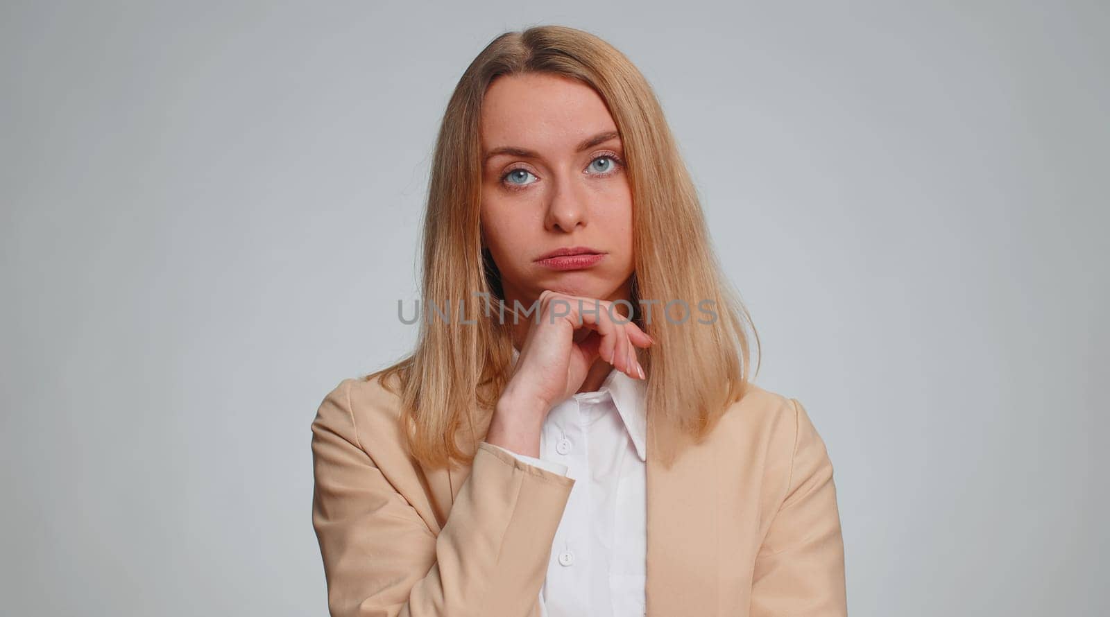 Sad business woman tired bored indifferent expression, exhausted of tedious story, not interested in communication talk, displeasure, uninteresting. Girl isolated indoor on gray studio background