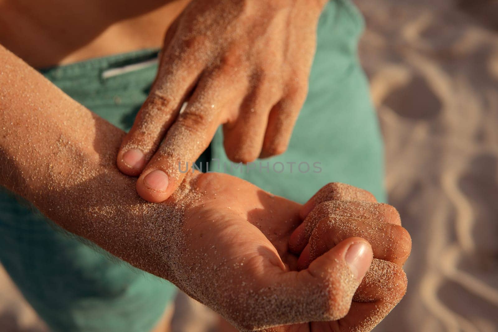 a man checks his pulse after training. bali