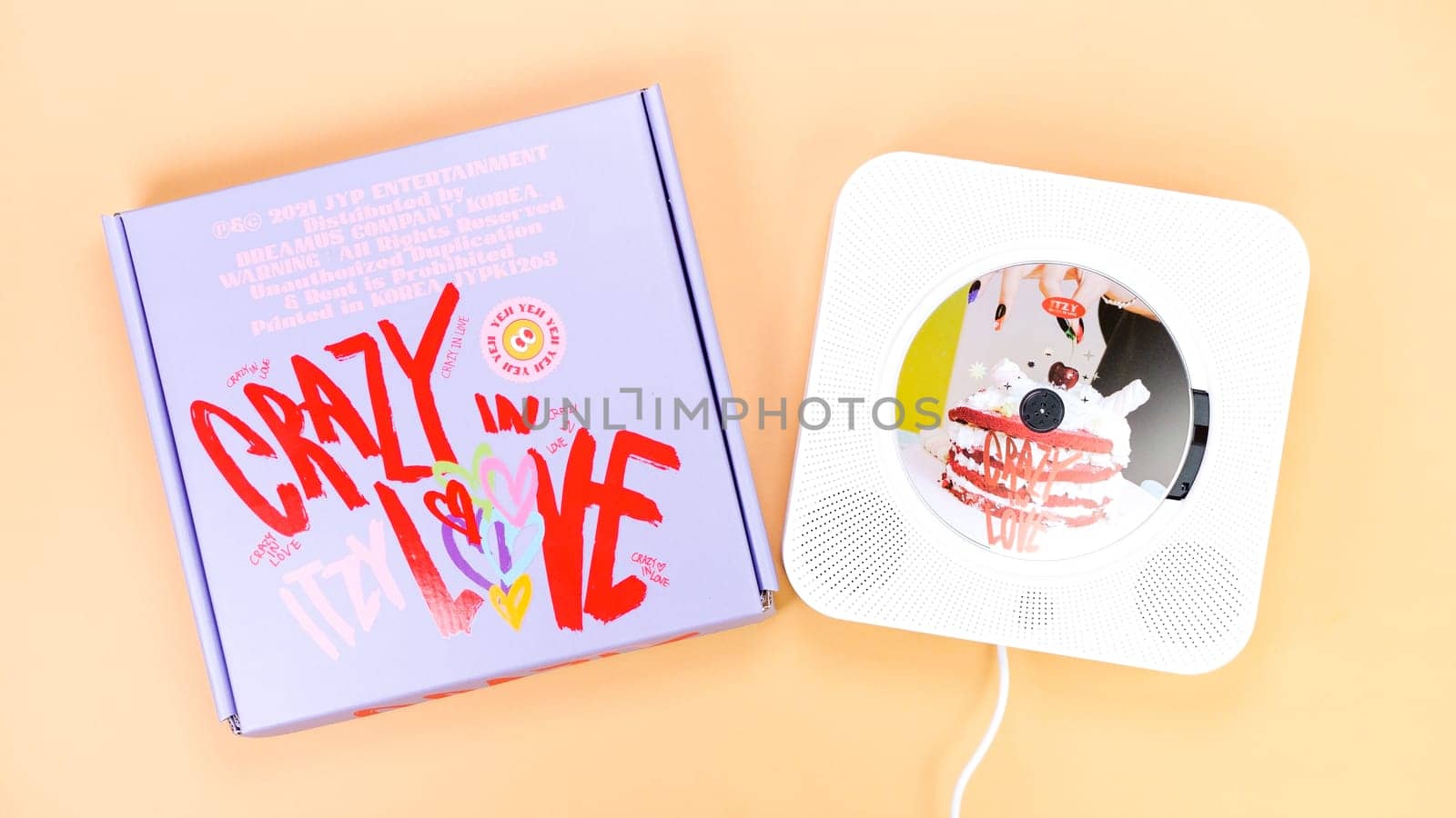 K-pop group Itzy CRAZY IN LOVE 1st Album on yellow background. Special edition music CD. South Korean girl group Itzy. Space for text. Gatineau, QC Canada - March 10 2023.