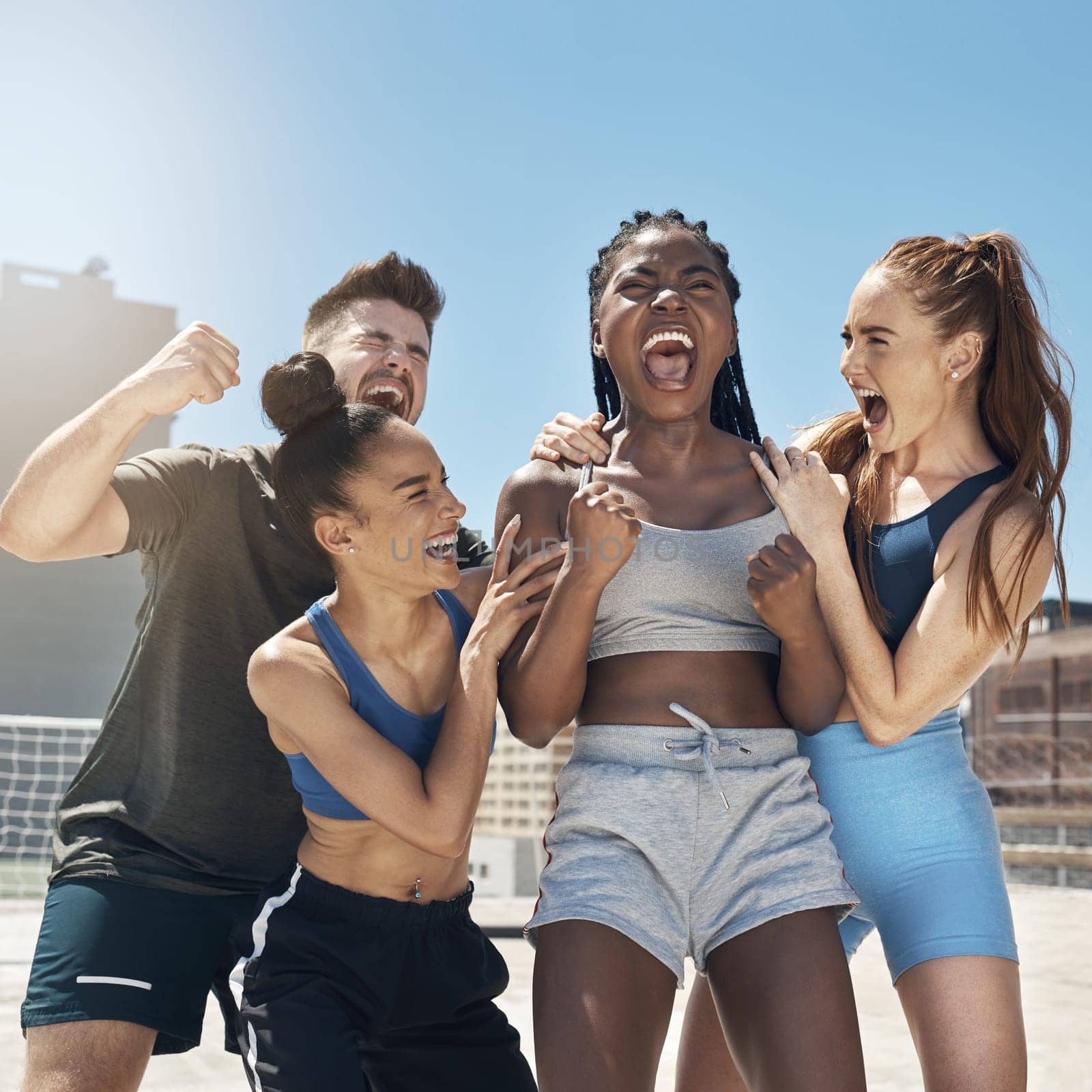 Fitness, happy and friends in workout celebration in the city on a rooftop with achievement. Diversity, happiness and people celebrating sports victory for success, motivation and outdoor exercise