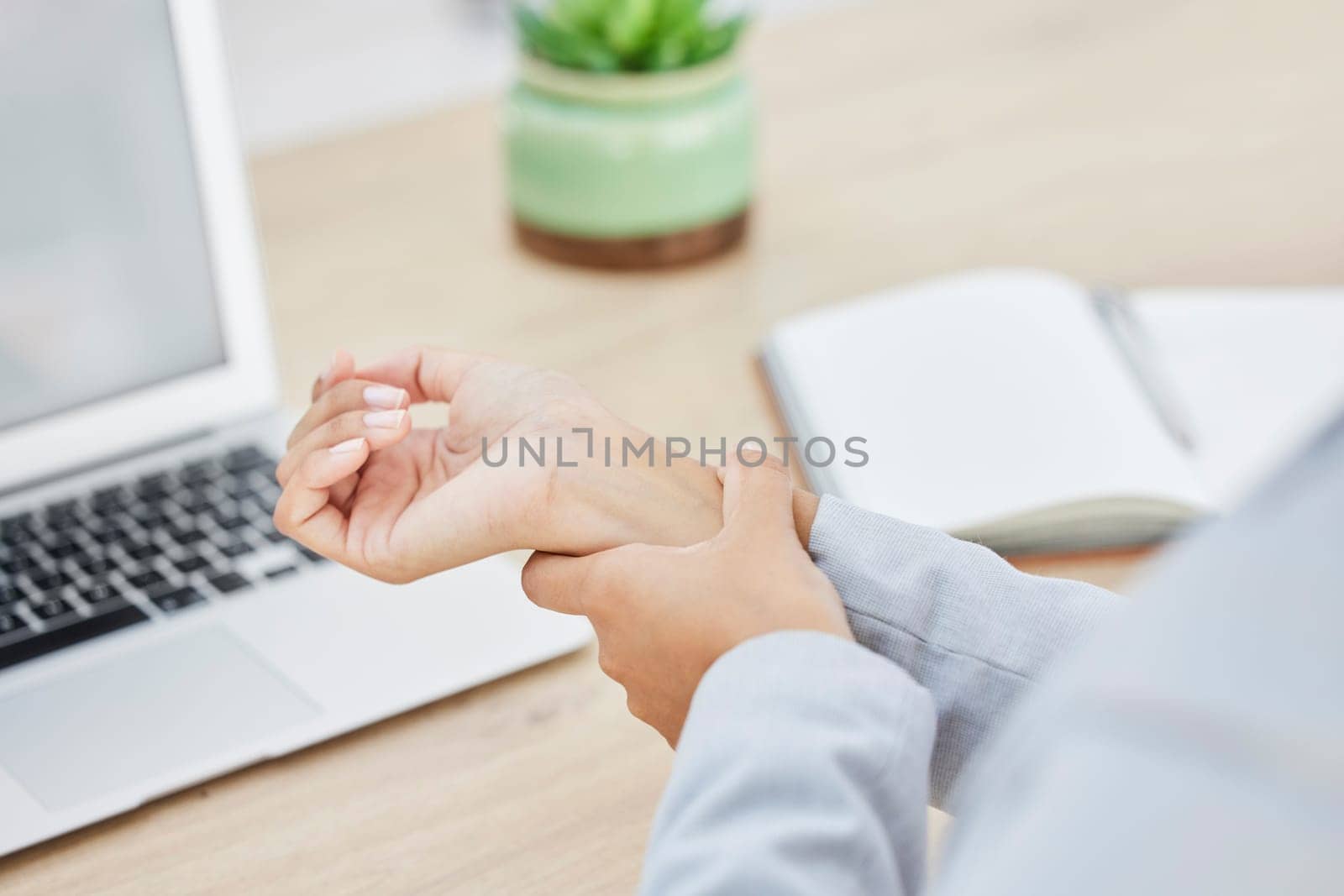 Laptop, hands or woman with carpal tunnel syndrome, pain or injury from typing on computer keyboard. Arthritis risk, crisis problem or worker with notebook and hurt wrist from planning event schedule by YuriArcurs