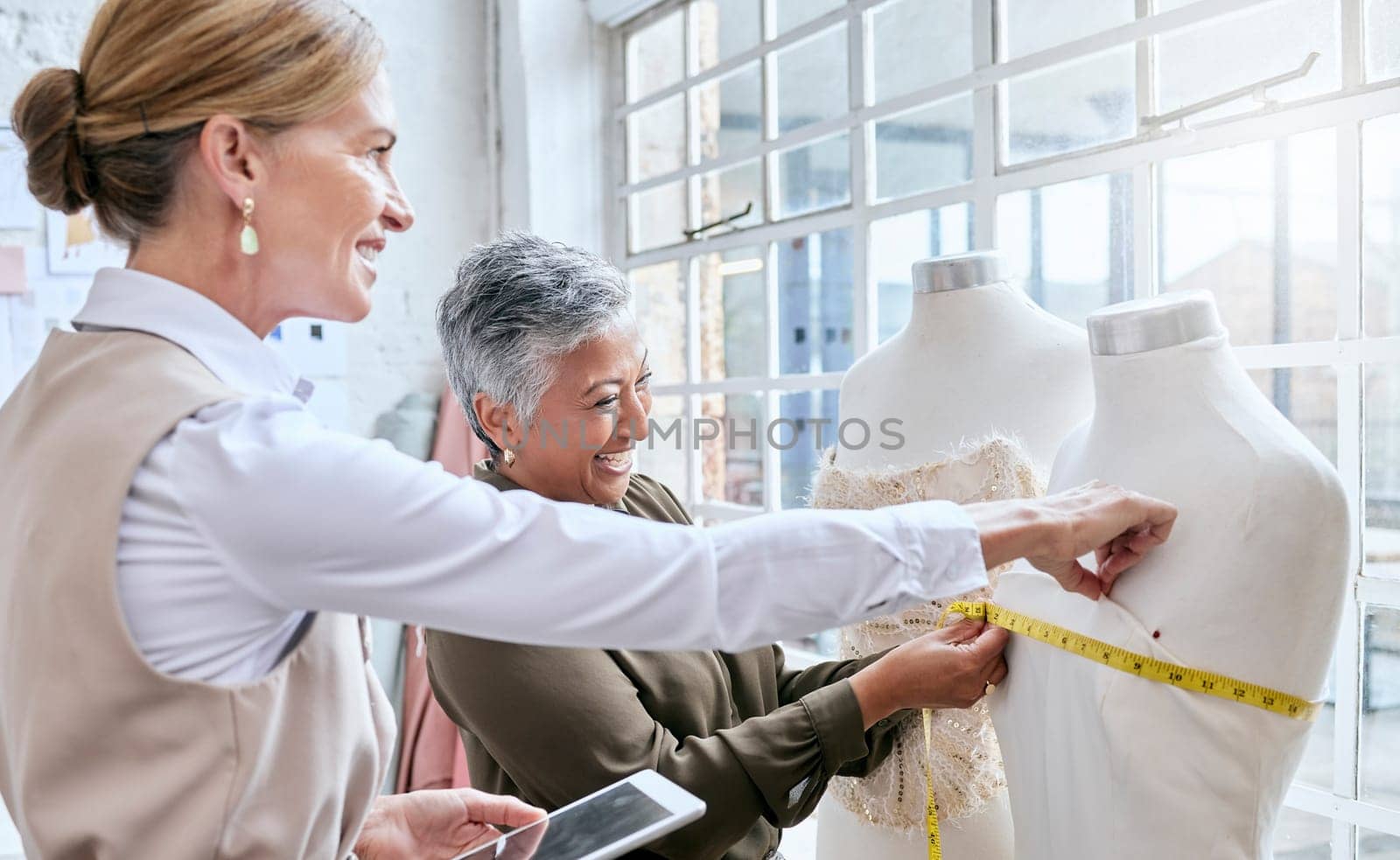 Fashion, designer and measure with business people and mannequin for planning, ecommerce and manufacturing. Management, tablet and tape with women in factory studio for retail and online shopping.