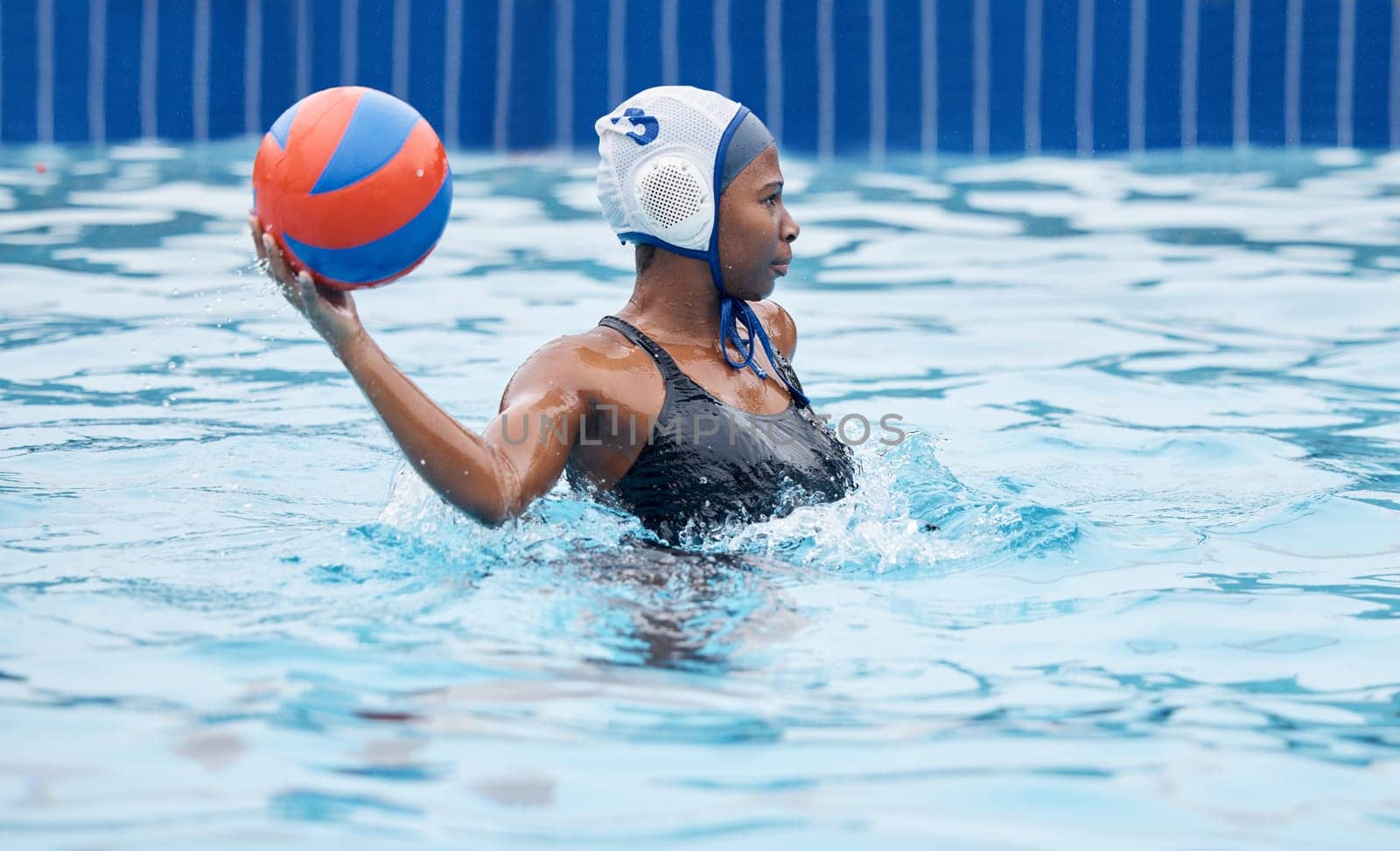 Water polo, woman and ball in pool for game, training or competition with fitness, vision or goal. African athlete, sports and college with splash, wellness or strategy for motivation, aim and focus by YuriArcurs