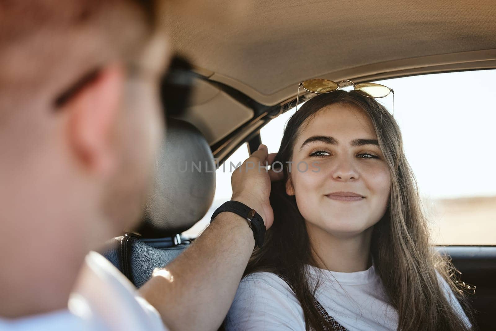 Love, travel and smile with woman in car with man on road trip vacation for summer, freedom and care. Happy, transportation and adventure with couple on date together for journey, relax and peace by YuriArcurs