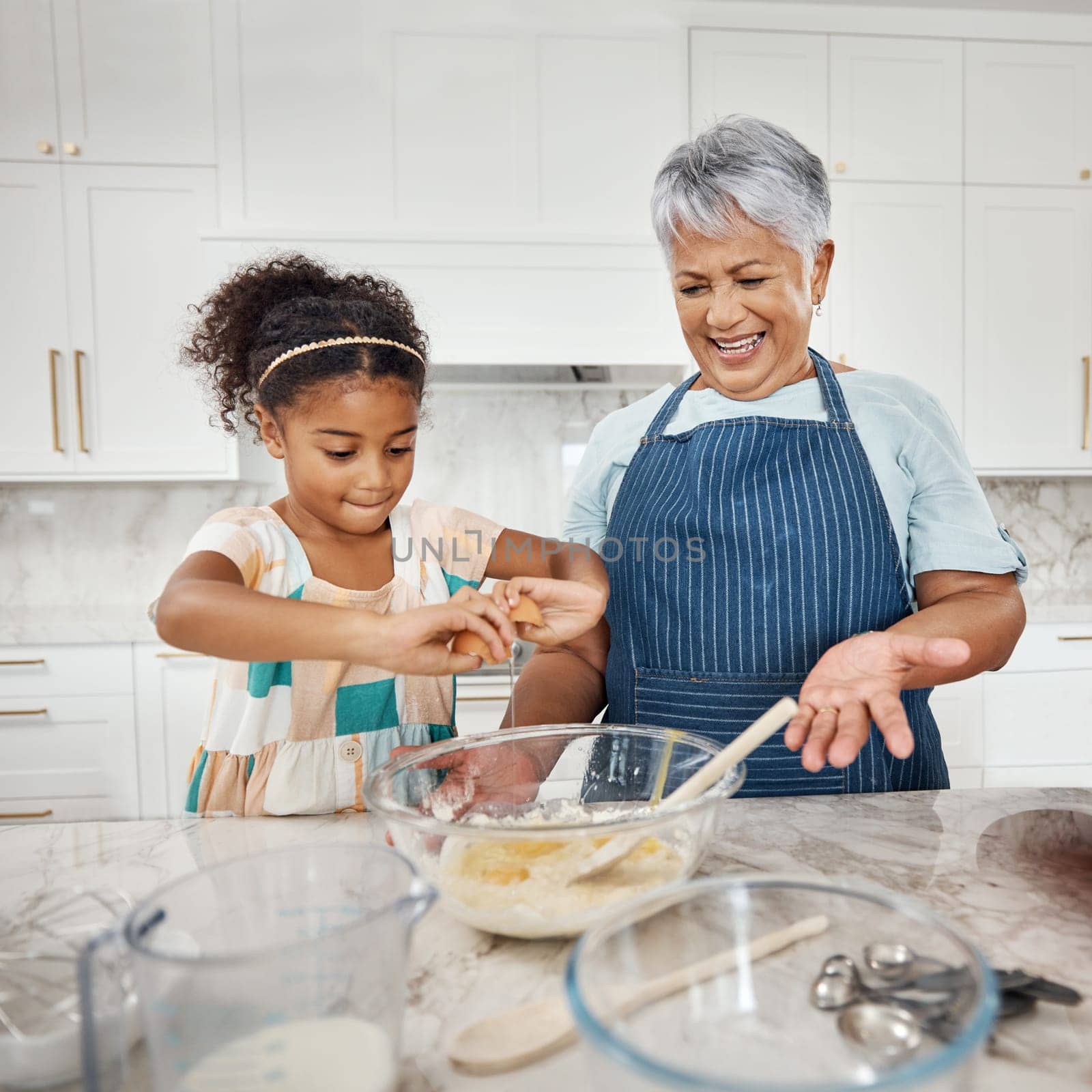 Learning, cooking grandmother and girl with egg and flour in bowl in home kitchen. Education, family care and happy grandma teaching child how to bake, bonding and enjoying baking time together. by YuriArcurs