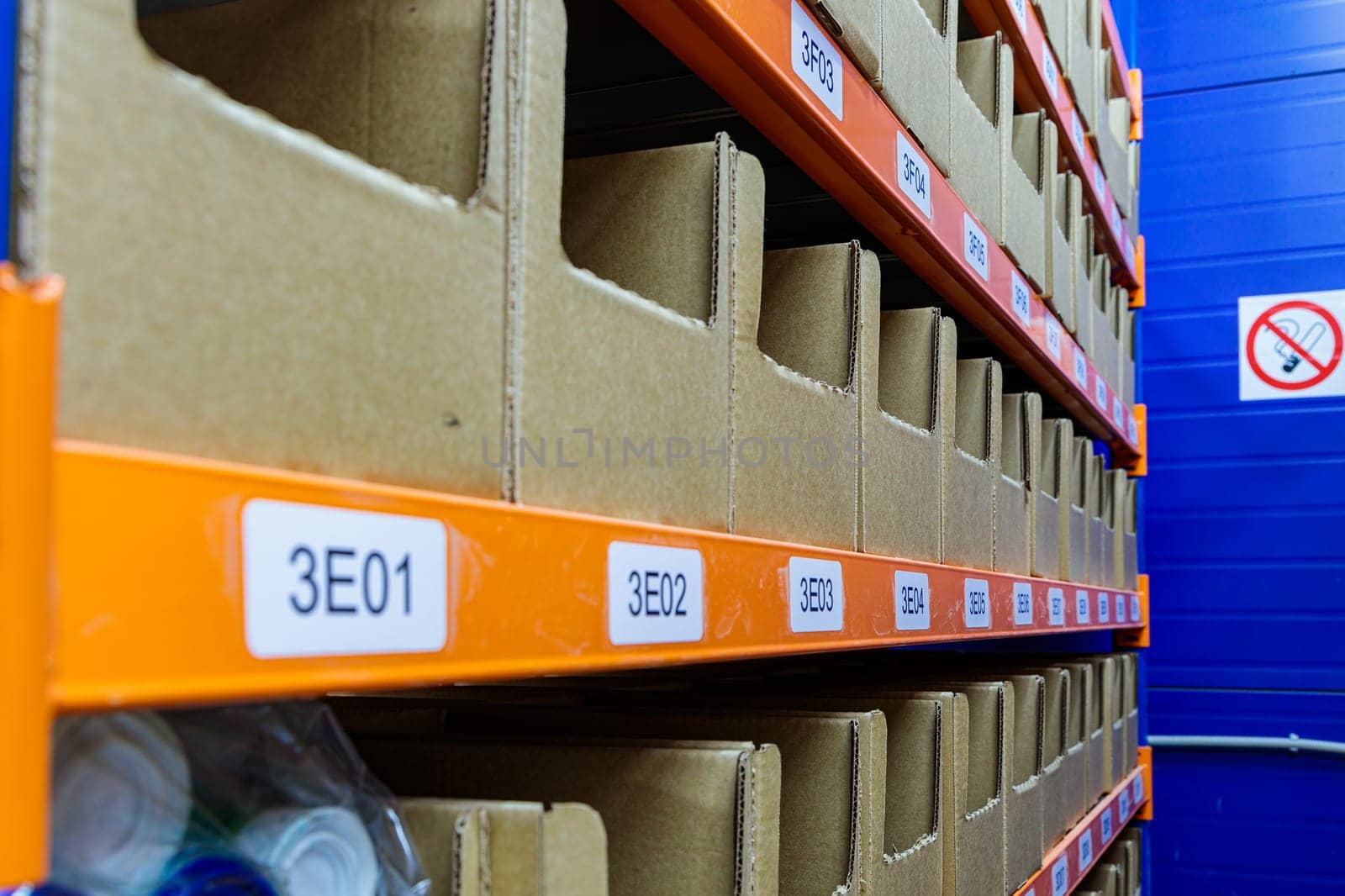 Boxes on racks in a warehouse of goods close-up. High quality photo