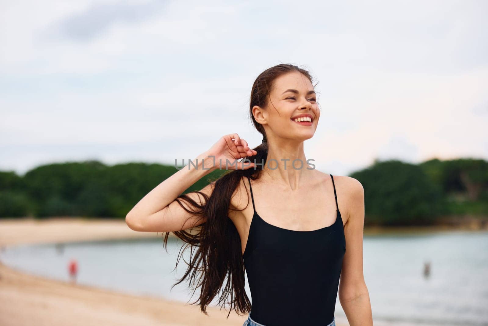 woman running beach travel summer activity lifestyle smile sunset young sea by SHOTPRIME