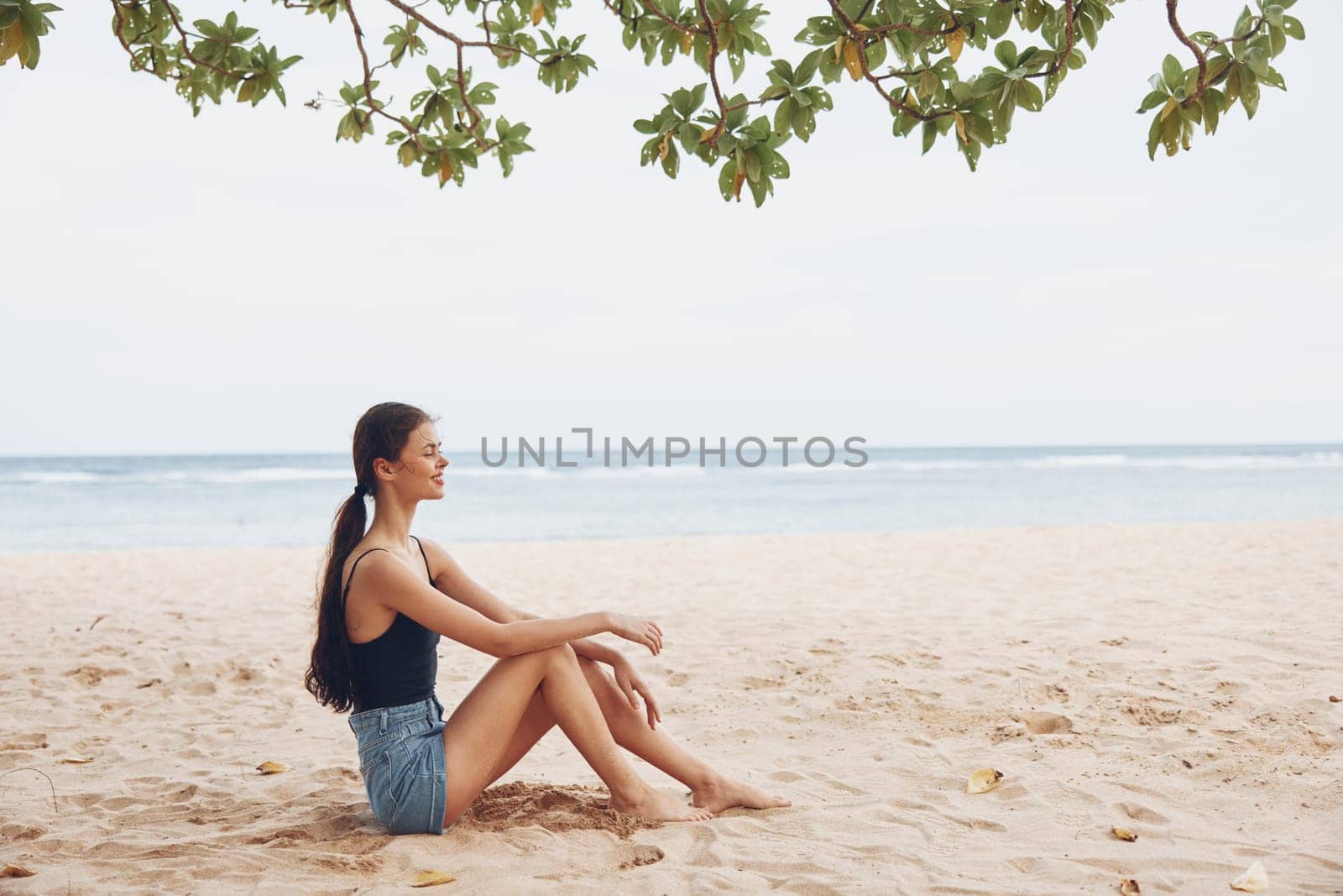 nature woman sea travel freedom smile sitting vacation beach alone sand by SHOTPRIME