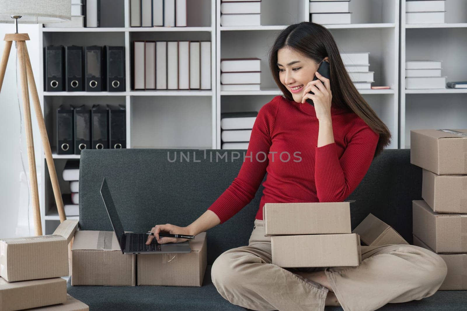 Small business owners online are telephone chatting, selling products and checking orders for products that customers order. of online retailers - online shopping.