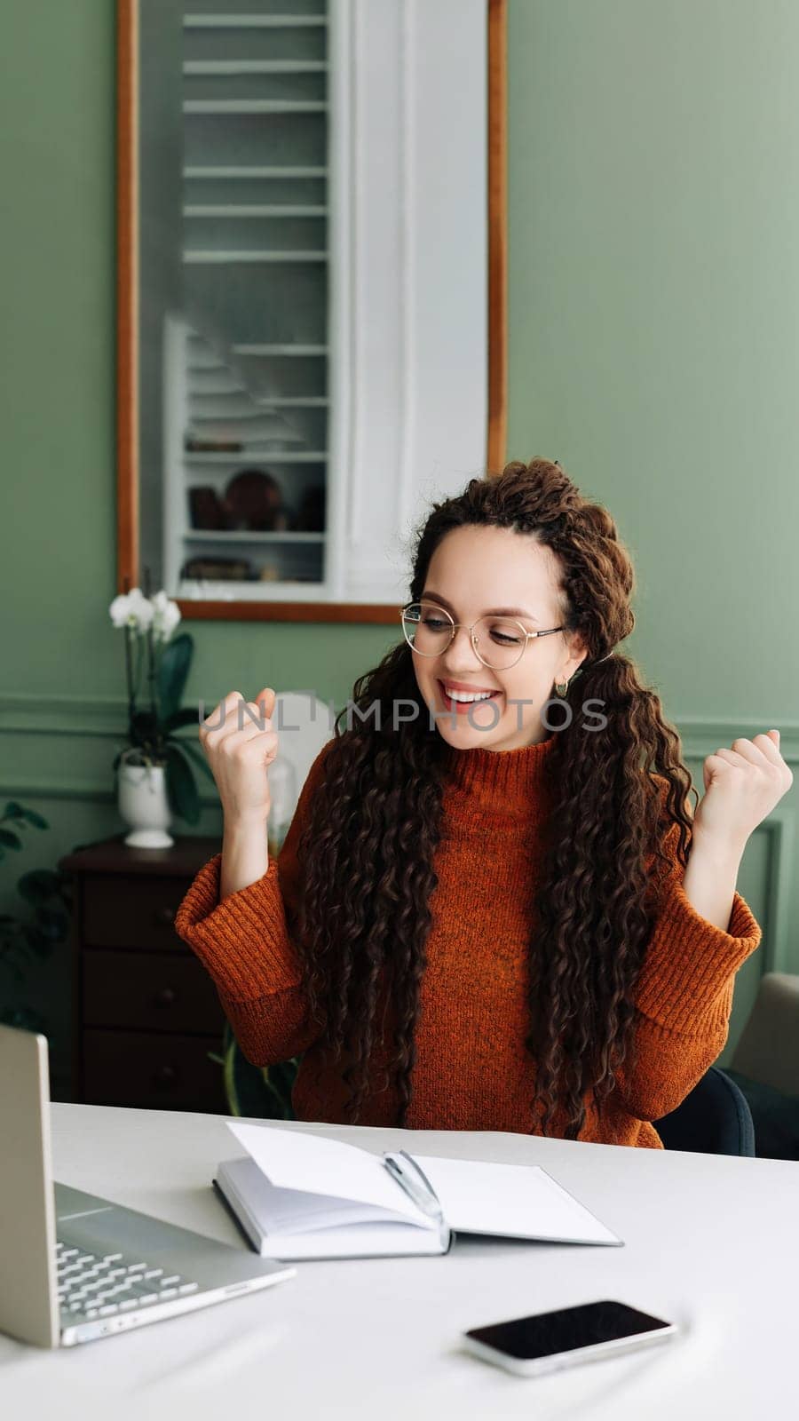 Happy Woman Winning Online: Receiving Good News via Email on Laptop Excited Student Celebrating Success on Laptop: Job Approval and Achievements Triumphant Student Winning Job Approval Overjoyed Woman