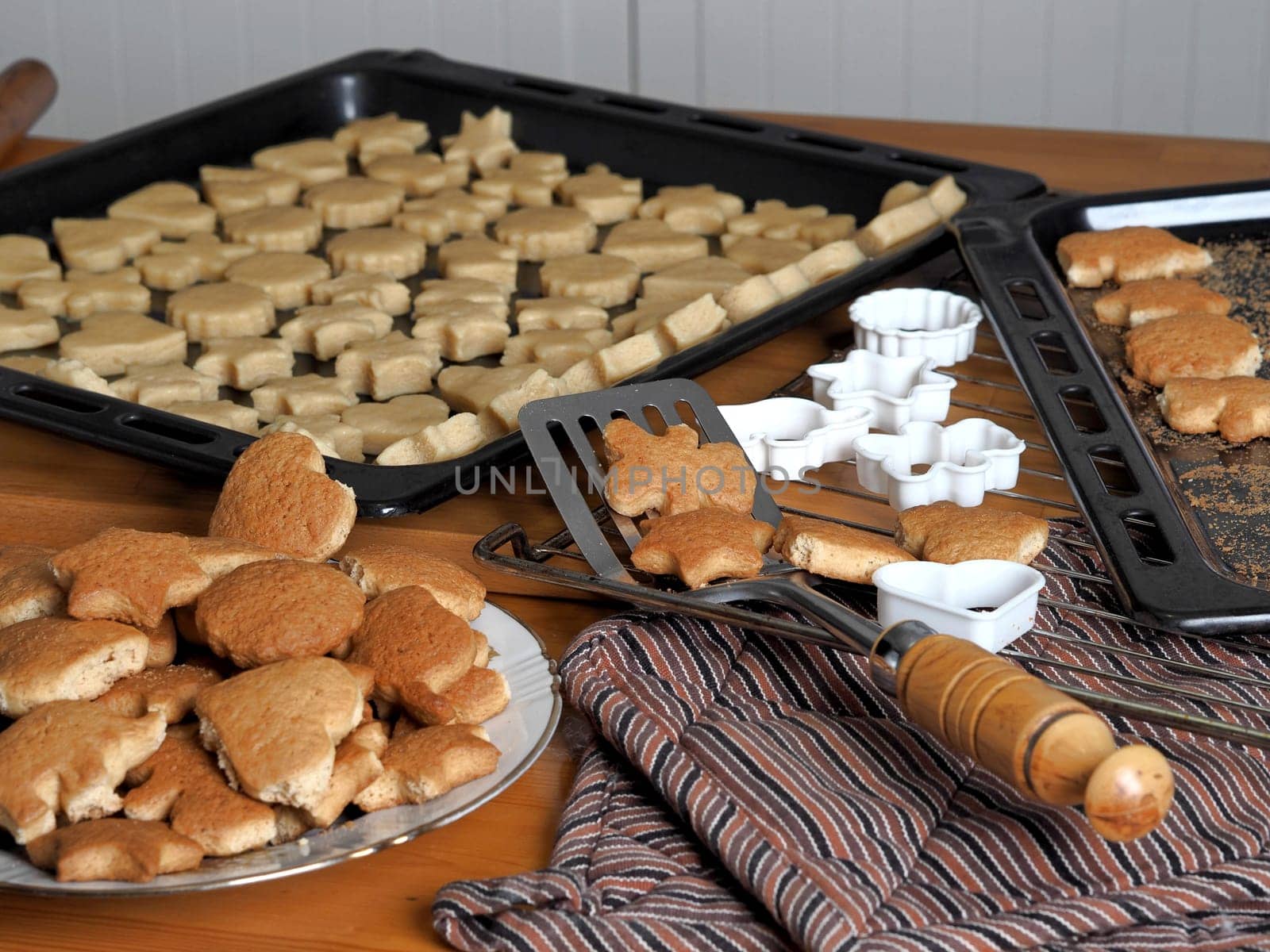 Food background with homemade cookies. The process of making cookies in the kitchen with dough and molds. by TatianaPink