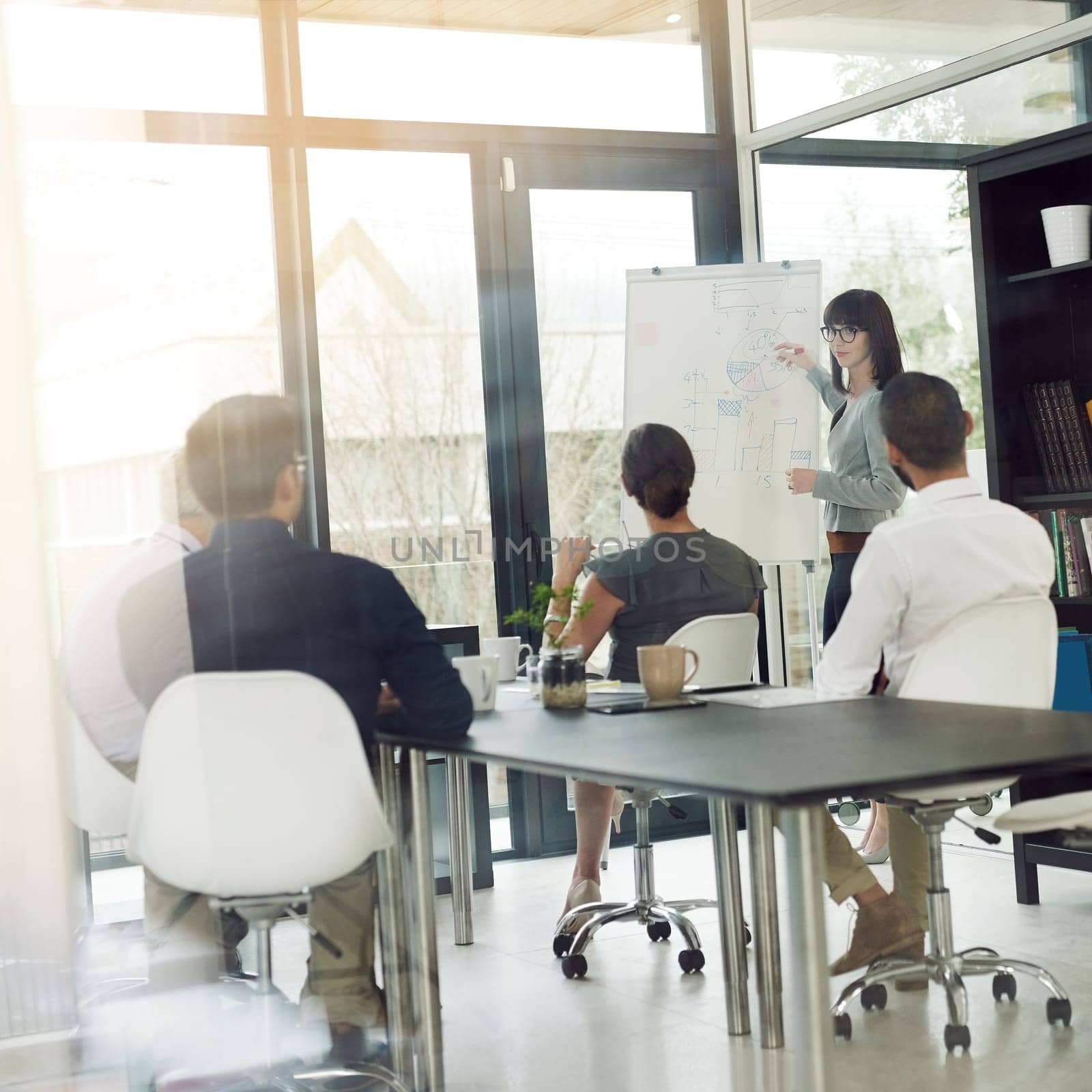 Meeting, teamwork and business people planning in a office brainstorming for a corporate project. Collaboration, whiteboard and professional employees working on a report in workplace conference room.