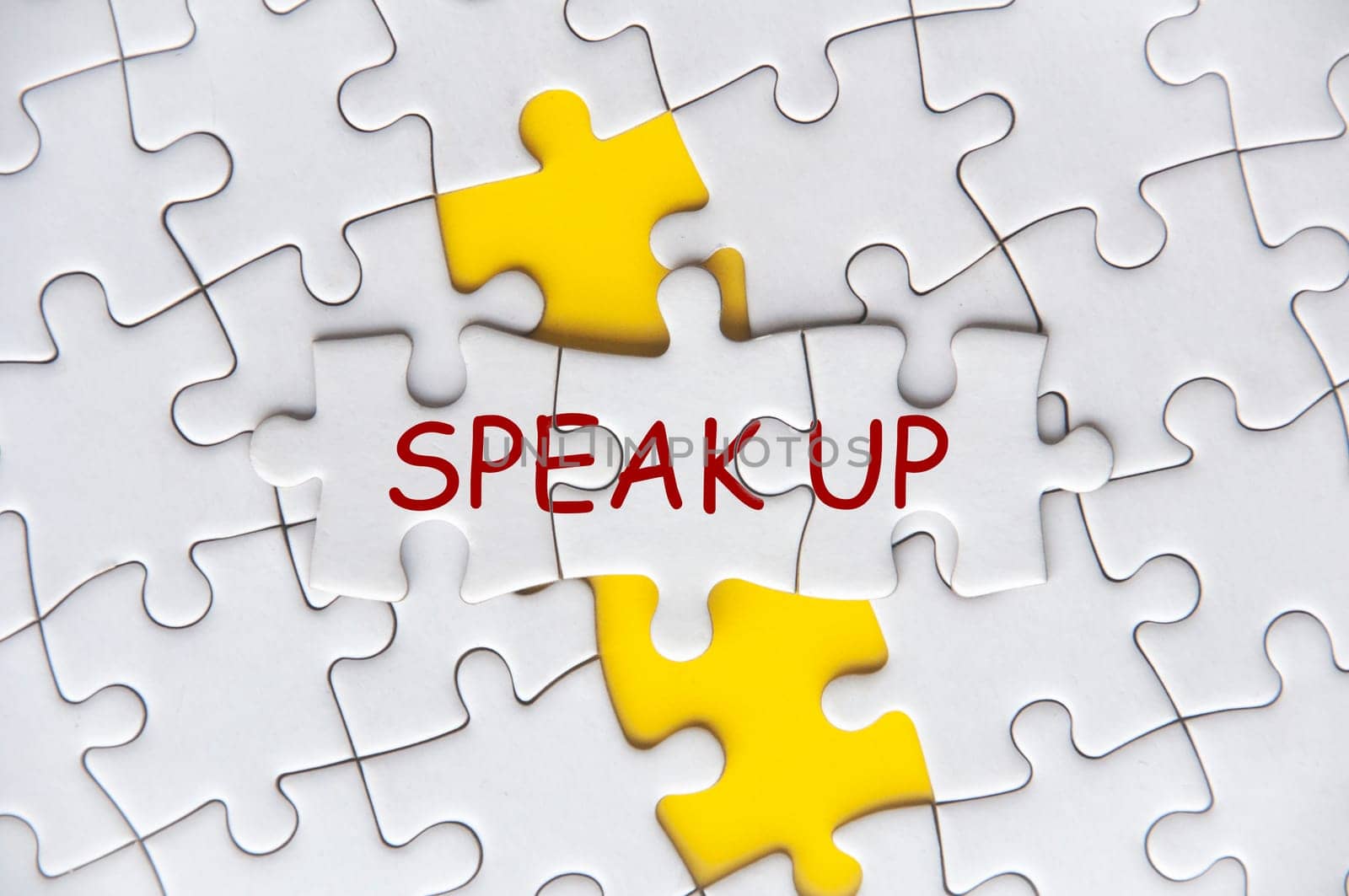 Speak Up text on missing jigsaw puzzle representing business culture in exercising rights to speak up by yom98