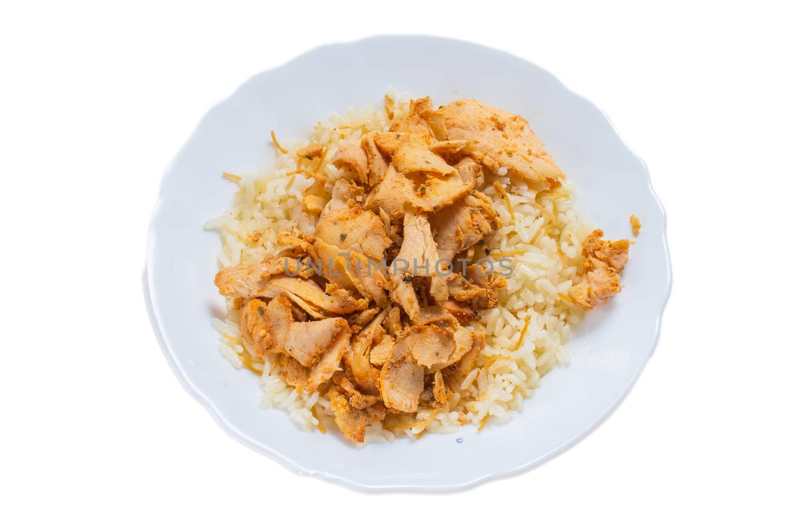 Turkish and Arabic Traditional Ramadan chicken doner kebab with tasty tomato sauce and rice or turkish pilav in white plate on wood table background. Pilav ustu tavuk doner by senkaya