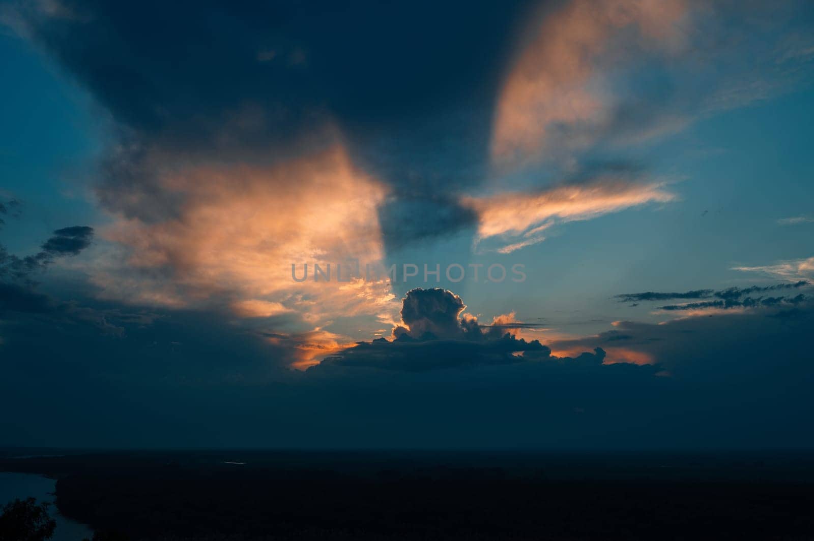 Real amazing sunset sky with gentle colorful clouds