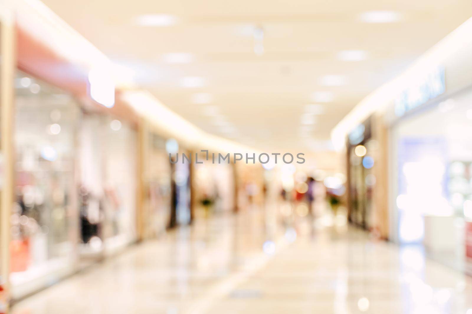 Luxury department store shopping mall interior, abstract defocused blur with bokeh background, concept of shopping seasons design.