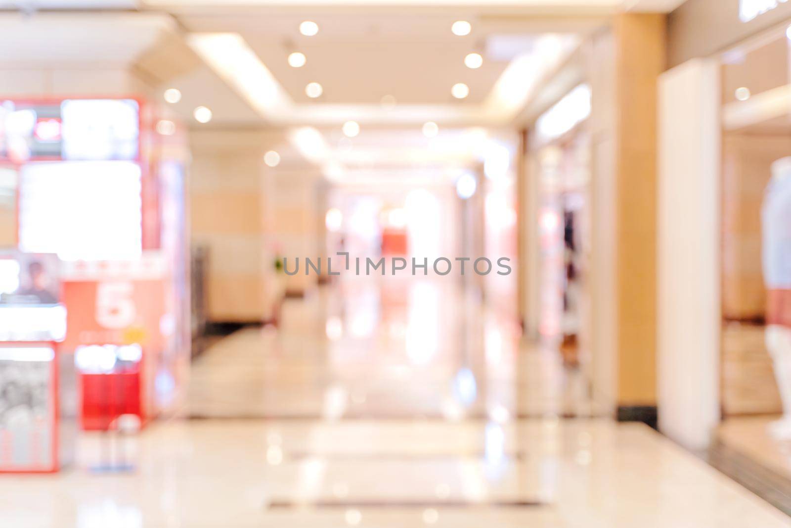 Luxury department store shopping mall interior, abstract defocused blur with bokeh background, concept of shopping seasons design.