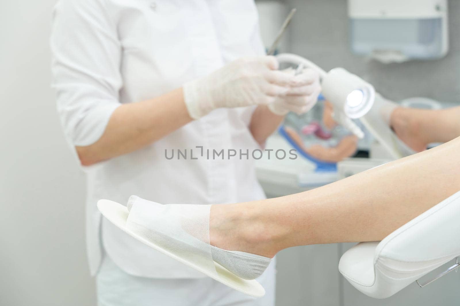 Young woman patient with a gynecologist during the consultation in the gynecological office