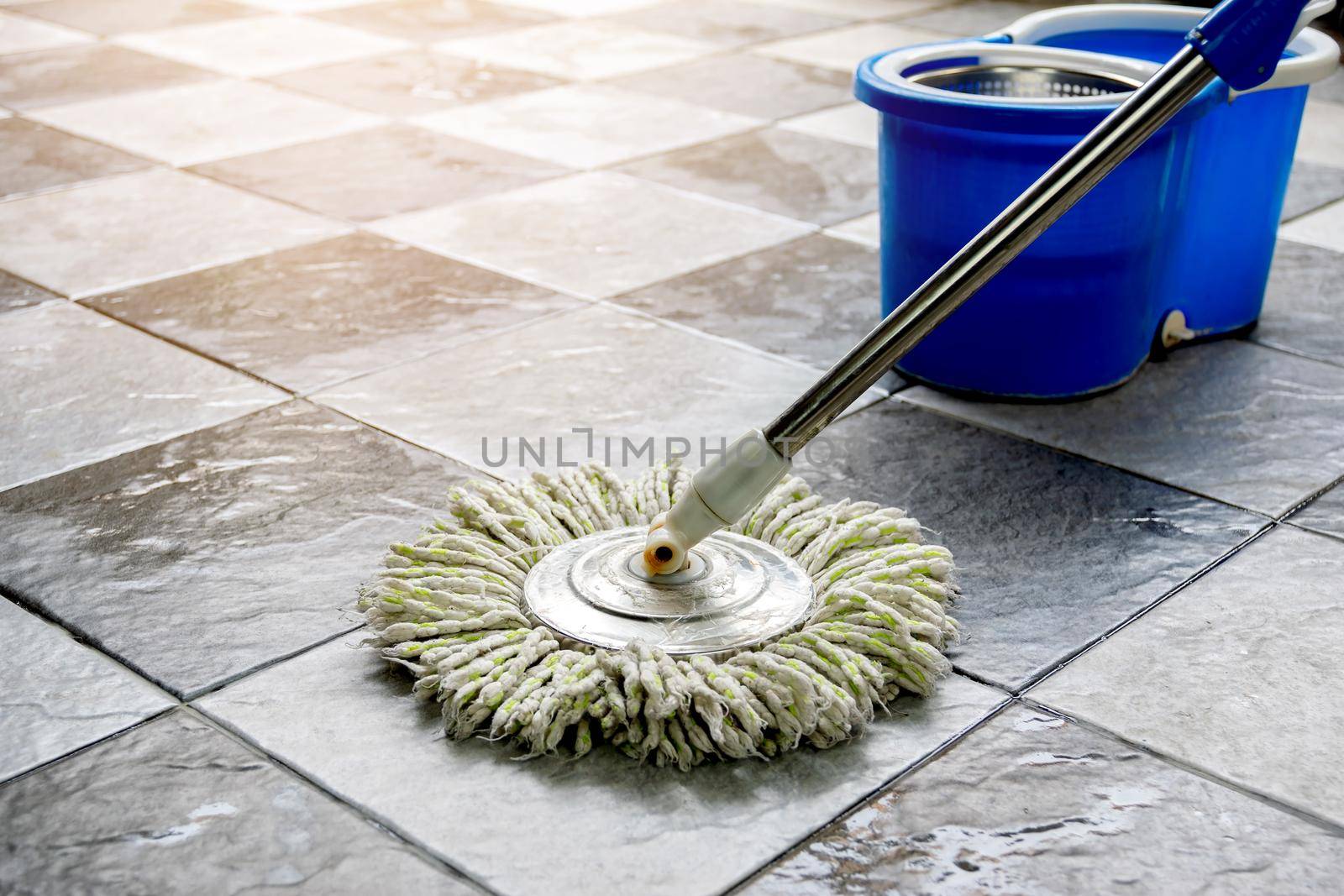 Clean tile floors with mops and floor cleaning products.