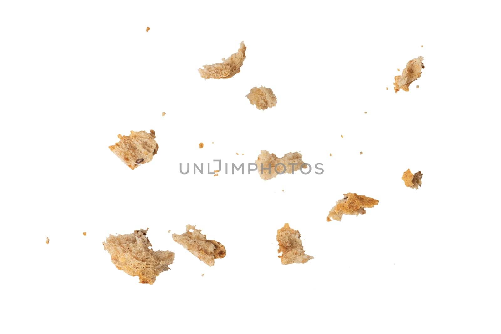 Crumbs of fresh whole grain bread isolated on white background. Isolate crumbs of different sizes for insertion into a design or project. High quality photo