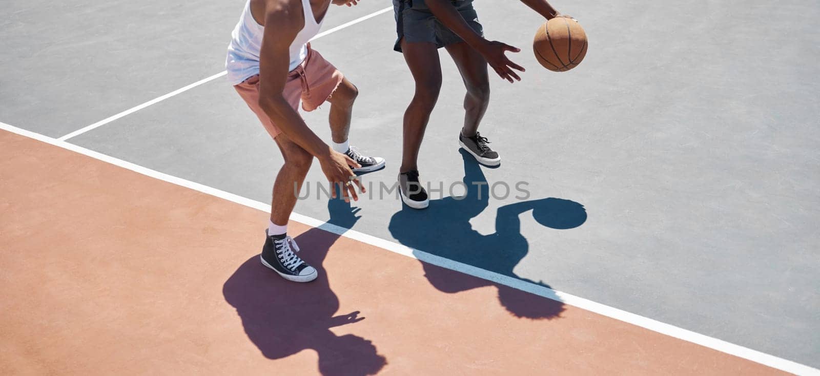 Sports, fitness and basketball training by men at basketball court for practice, exercise and stamina cardio. Sport, basketball player and friends playing competitive game outdoor, energy and workout by YuriArcurs