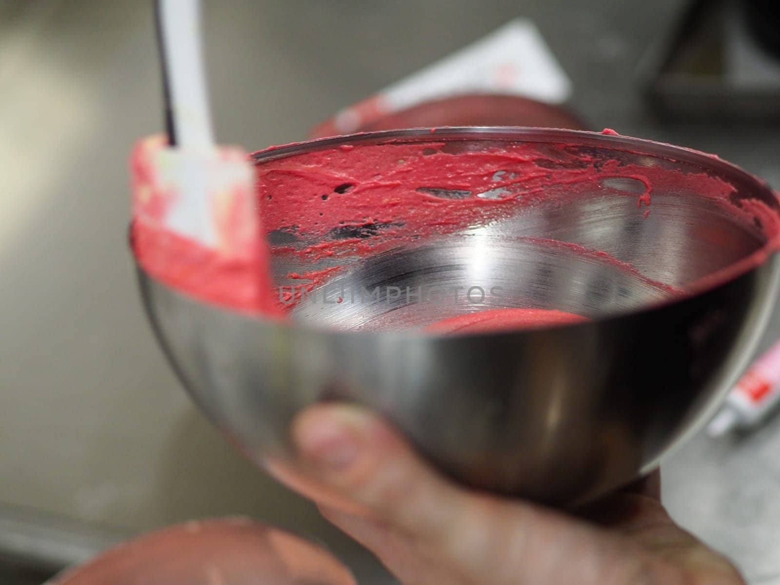 chef preparing white pink red cake creamy mixtures doughs to bake in the oven