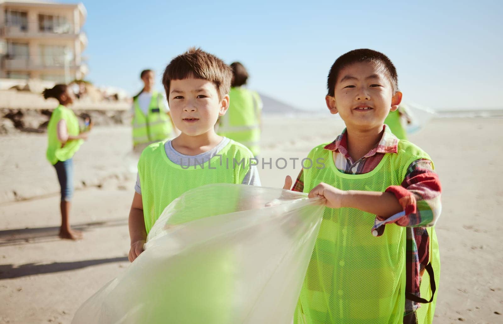 Children, portrait or trash collection bag in beach waste management, ocean cleanup or sea community service. Happy kids, climate change or cleaning volunteering plastic for nature recycling bonding.